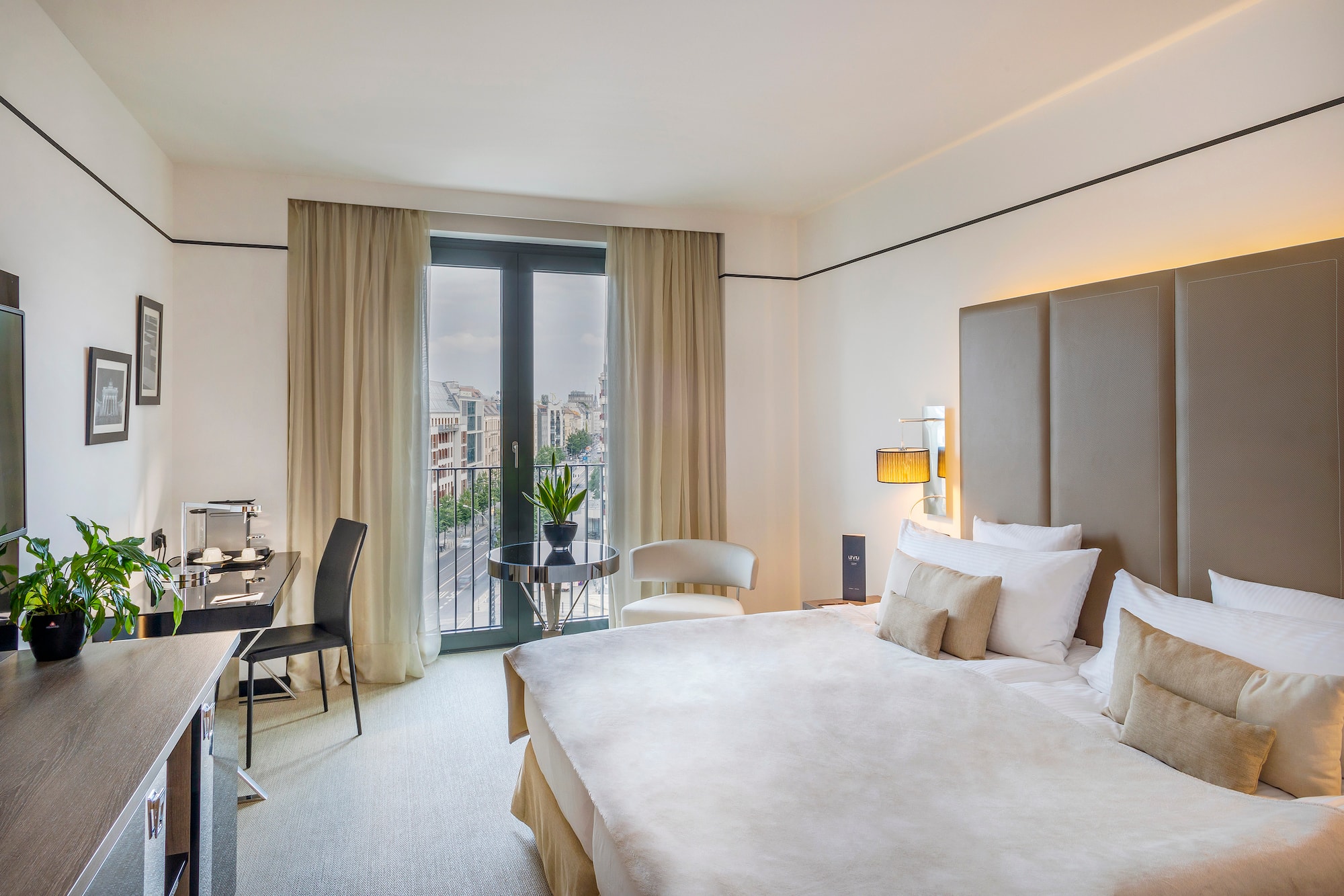 a bedroom with a bed and a desk and chair