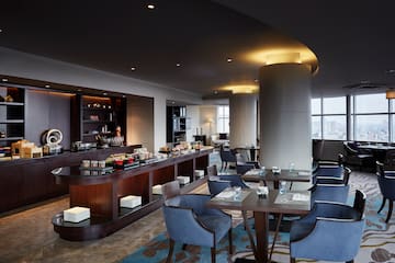 a restaurant with tables and chairs