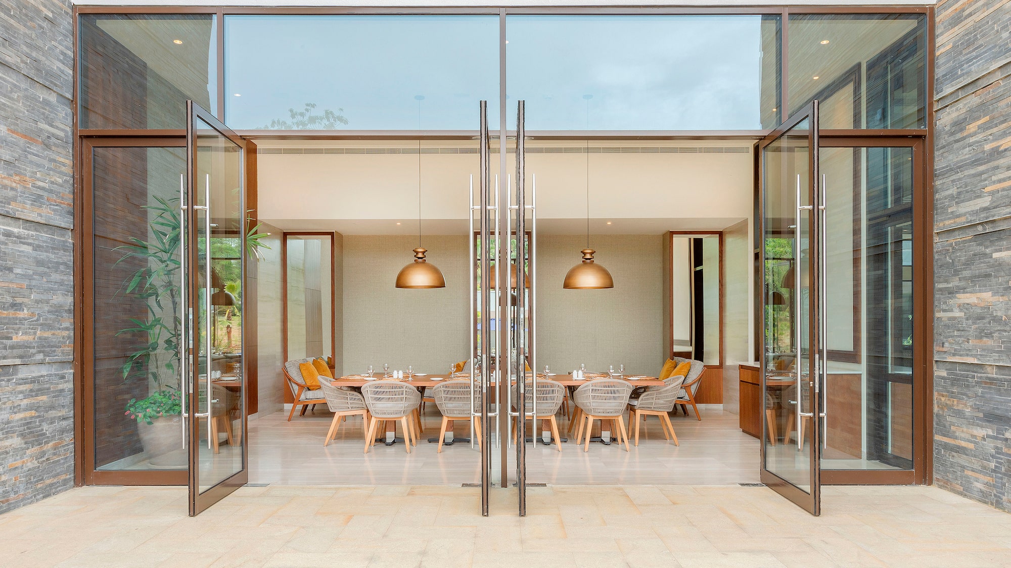 a glass doors with a table and chairs