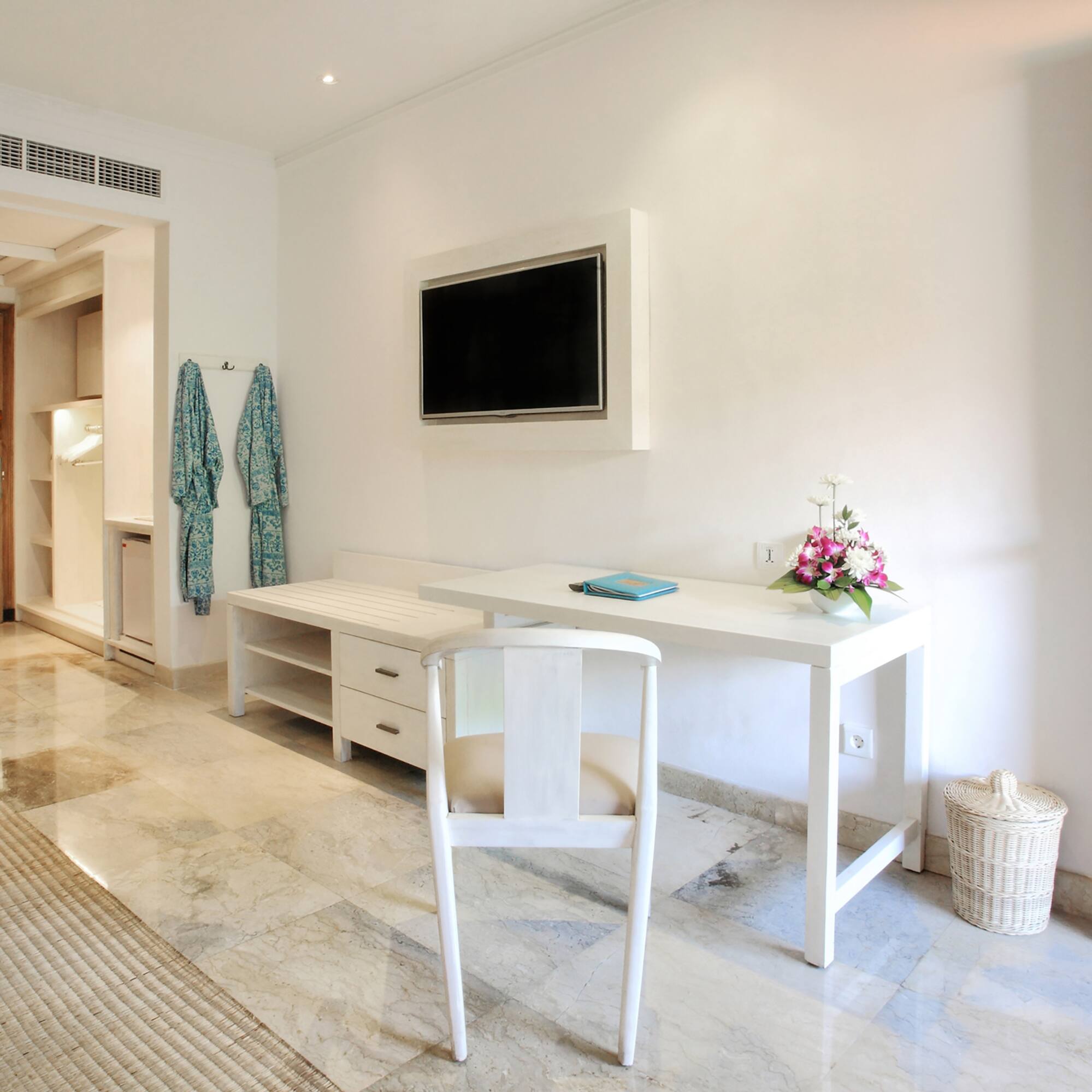 a white desk and chair in a room