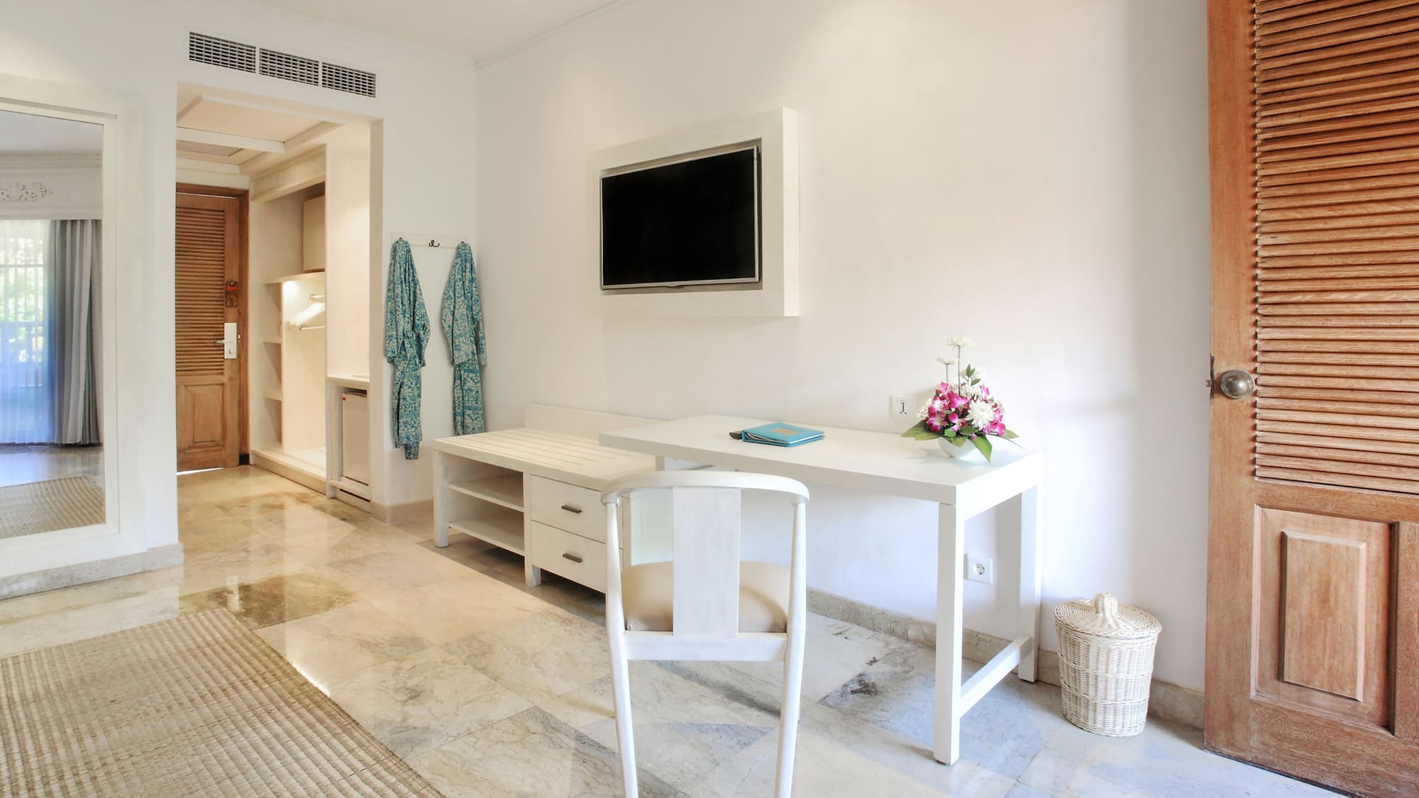 a white desk and chair in a room