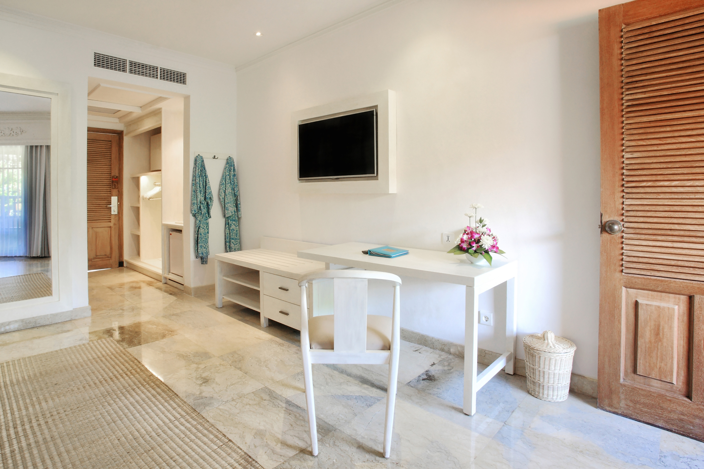 a white desk and chair in a room