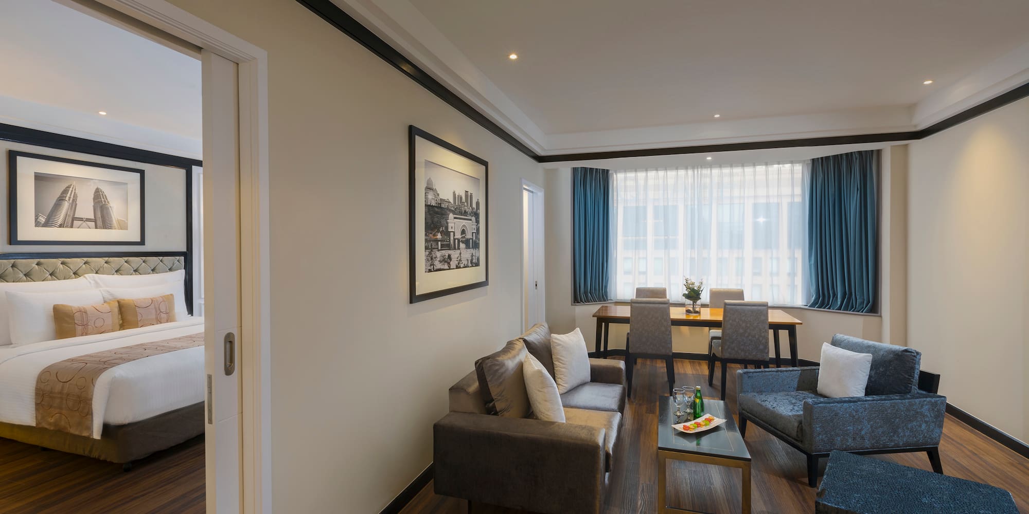 a room with a couch and chairs