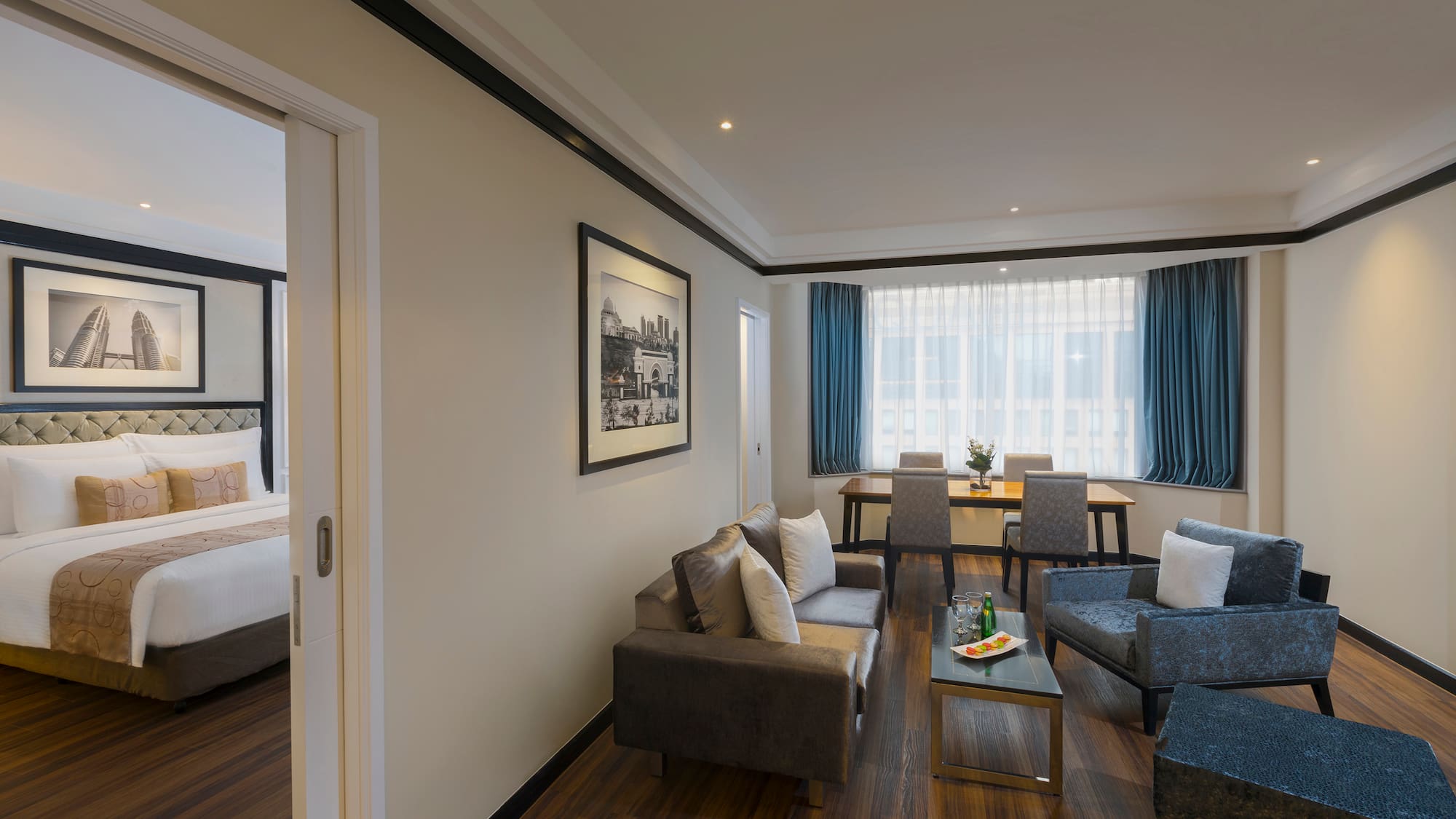 a room with a couch and chairs