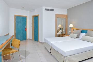 a room with a bed and a chair