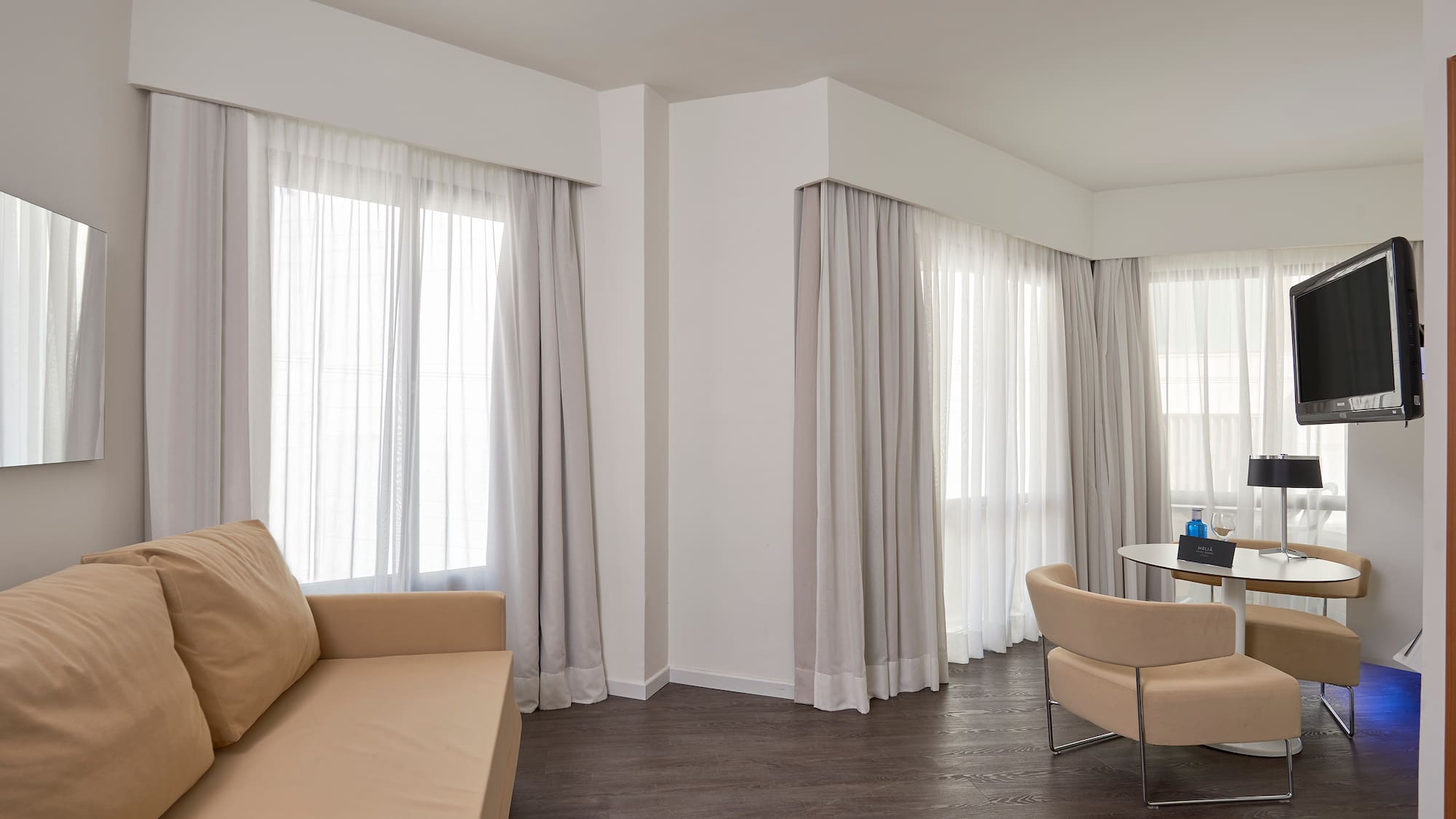 a living room with a couch and chairs