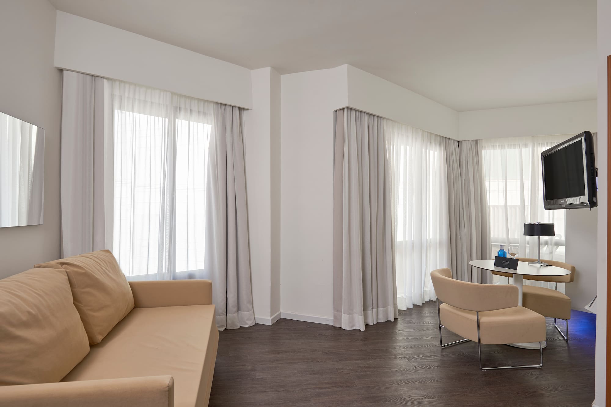 a living room with a couch and chairs