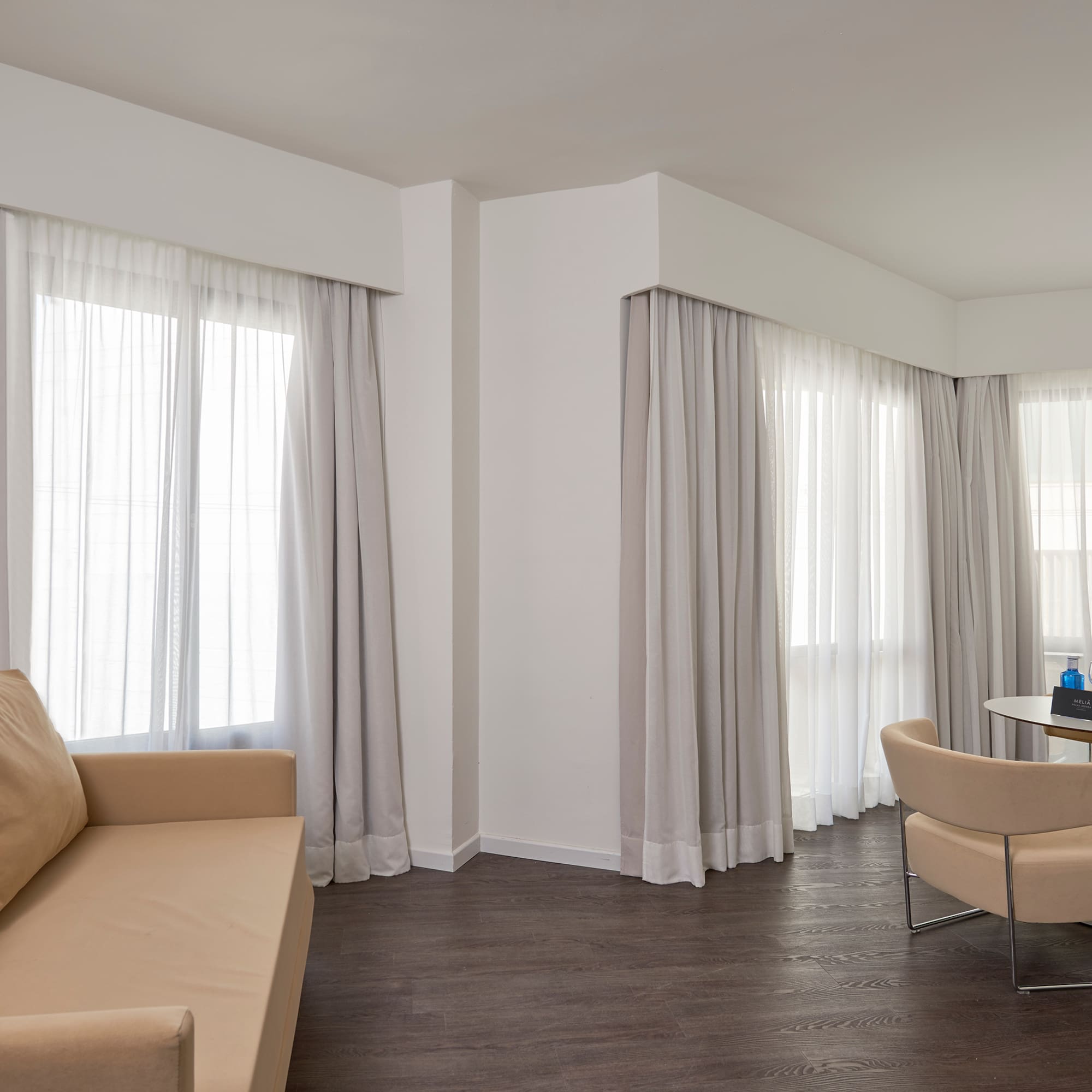 a living room with a couch and chairs