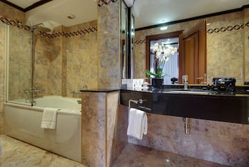 a bathroom with a tub and sink