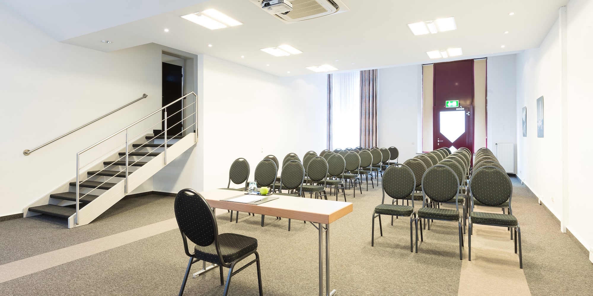 a room with chairs and tables