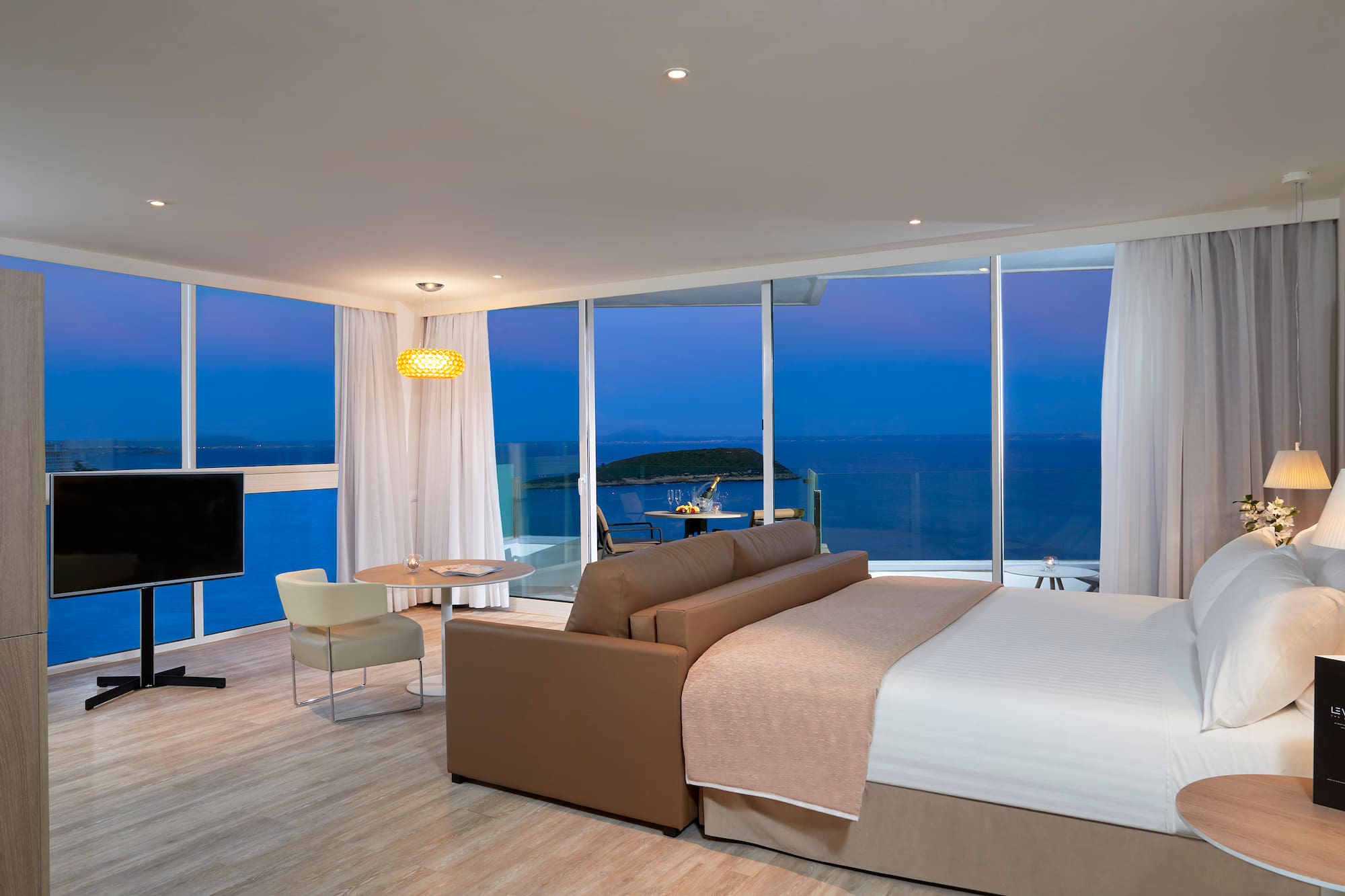 a room with a large window overlooking the ocean