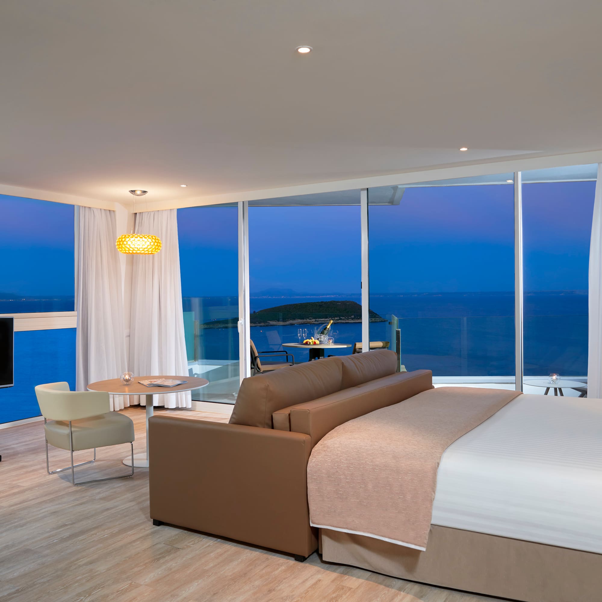 a room with a large window overlooking the ocean