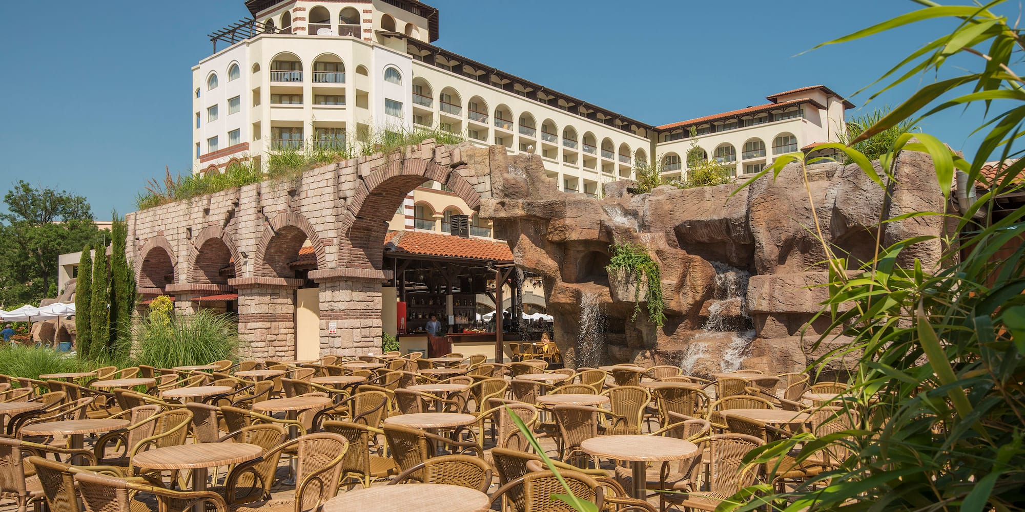 a group of tables and chairs outside a building