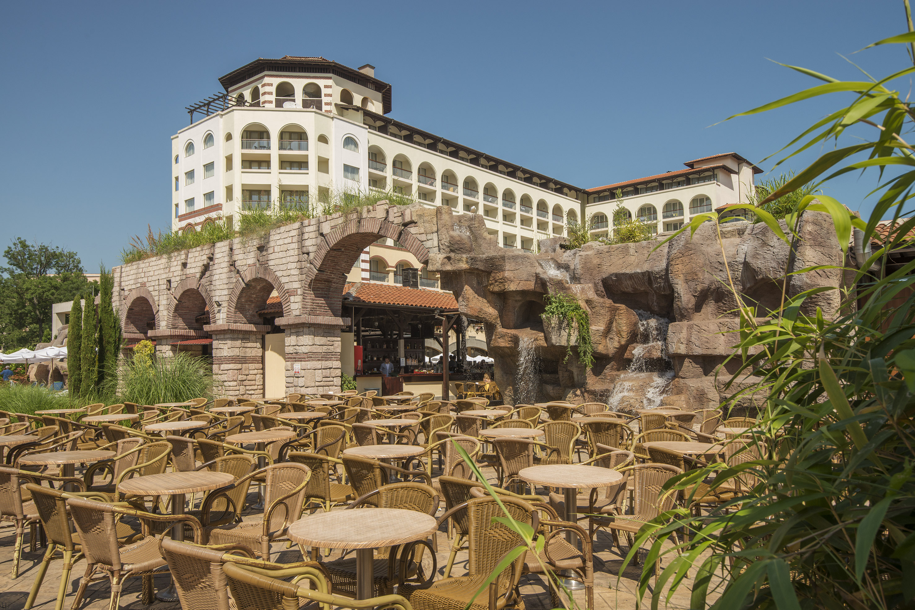 a group of tables and chairs outside a building