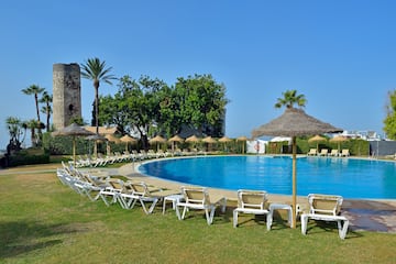 a pool with umbrellas and chairs