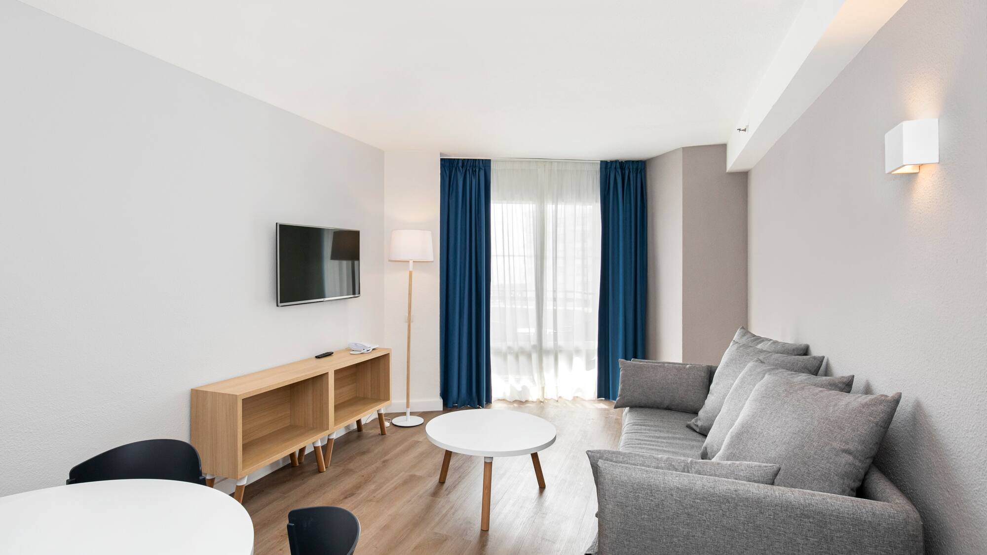 a room with a couch and a tv