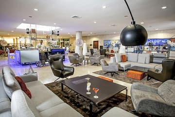 a room with a large table and chairs