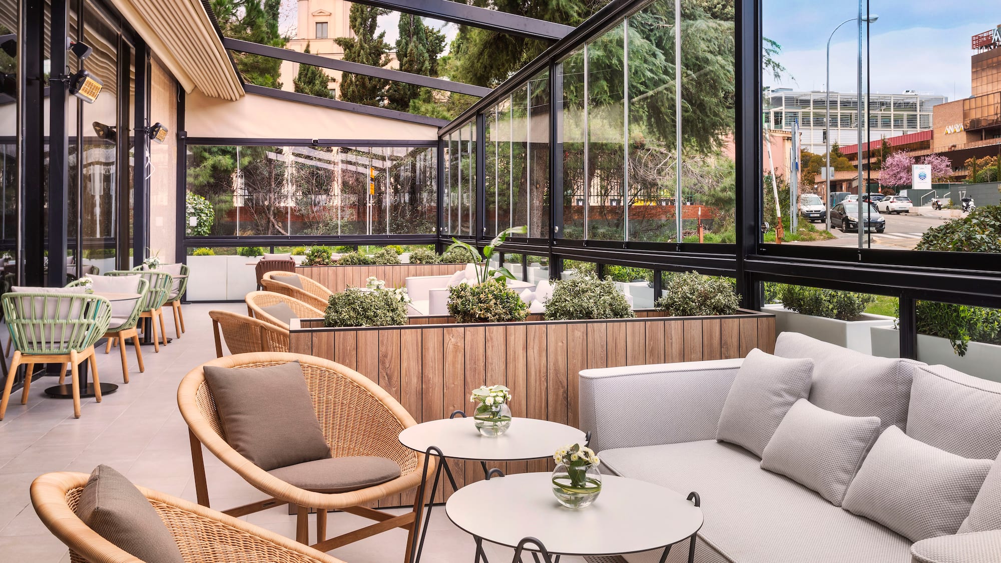 a patio with a couch and chairs