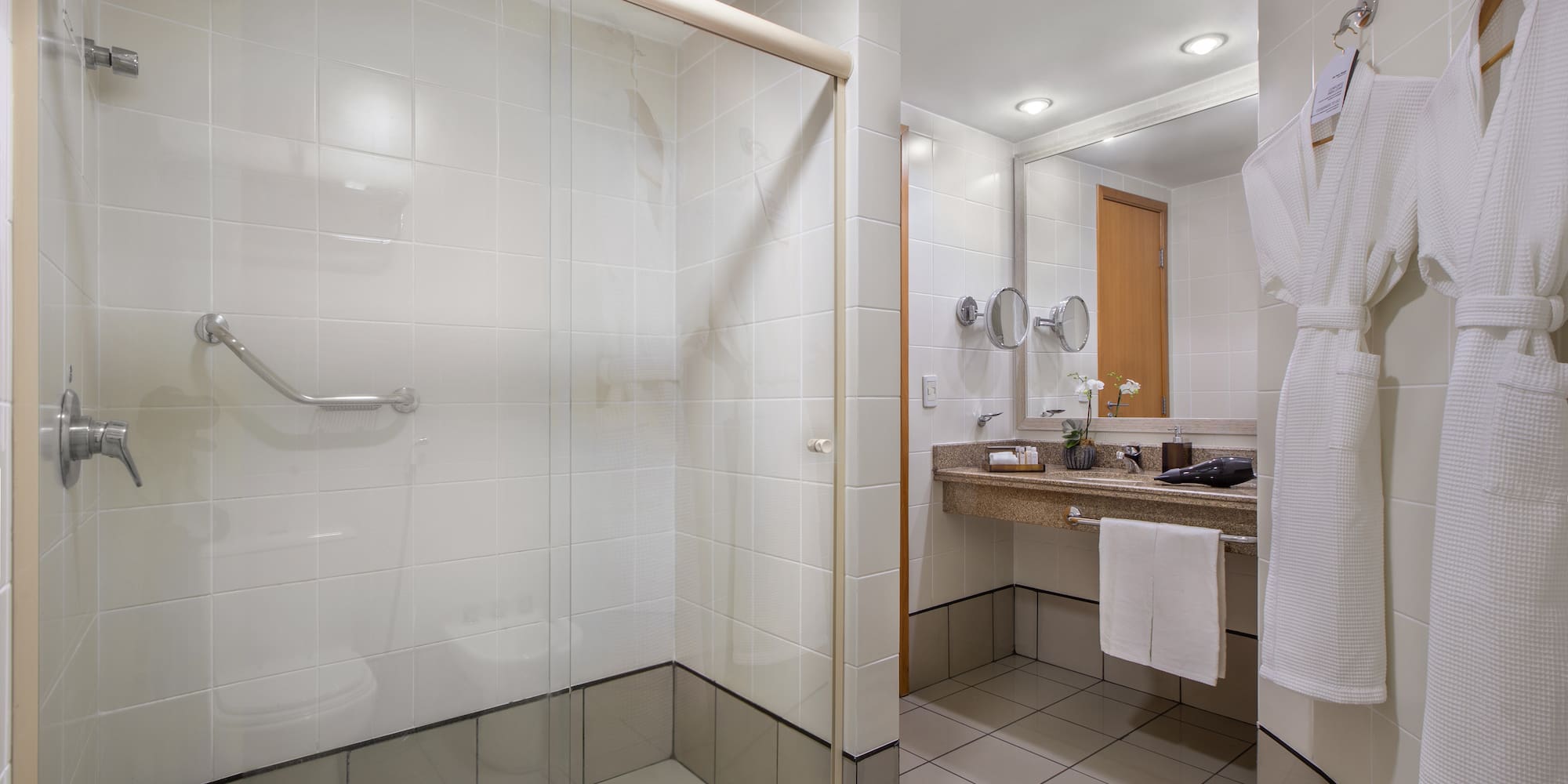 a bathroom with a glass shower door