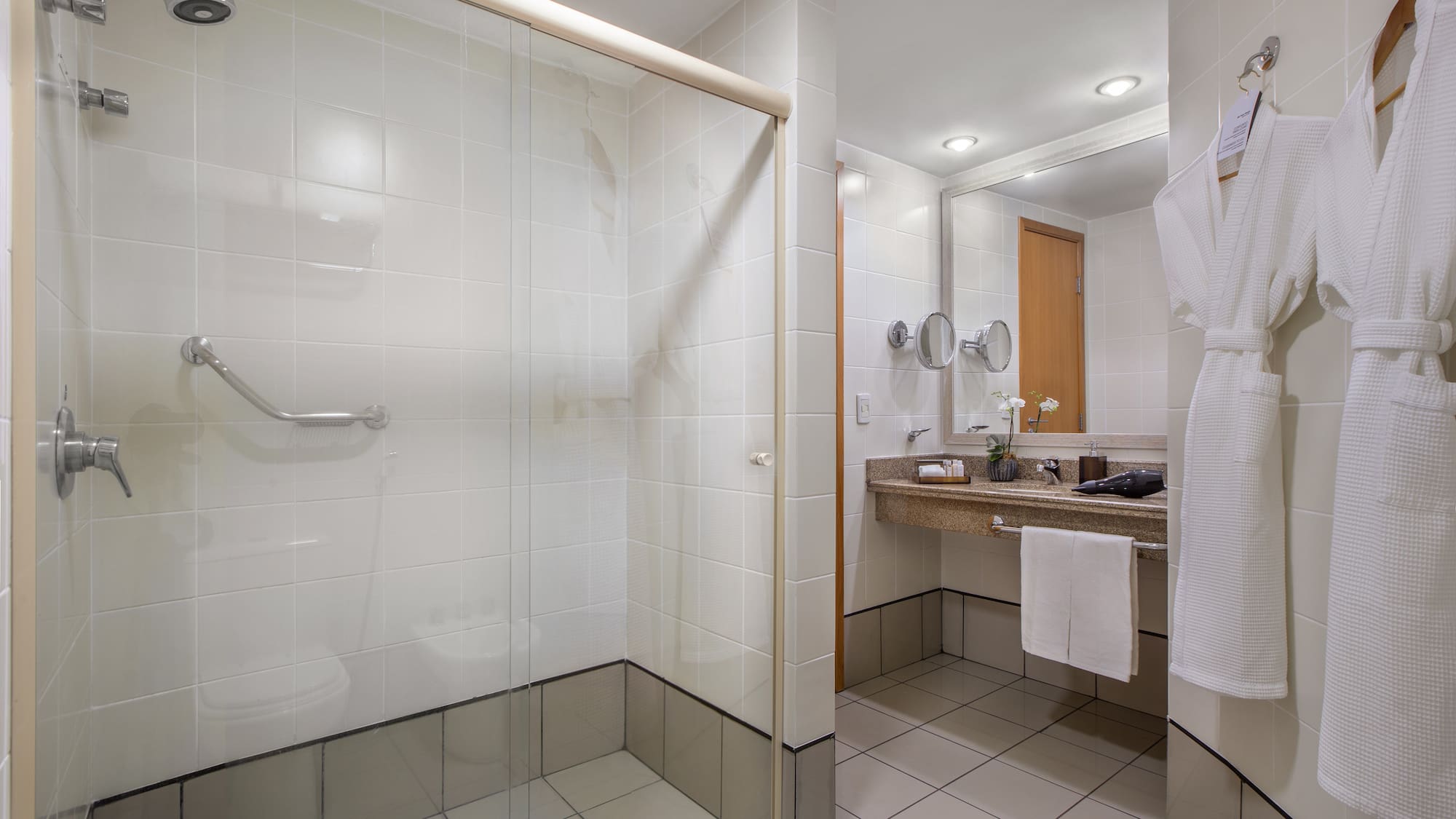 a bathroom with a glass shower door