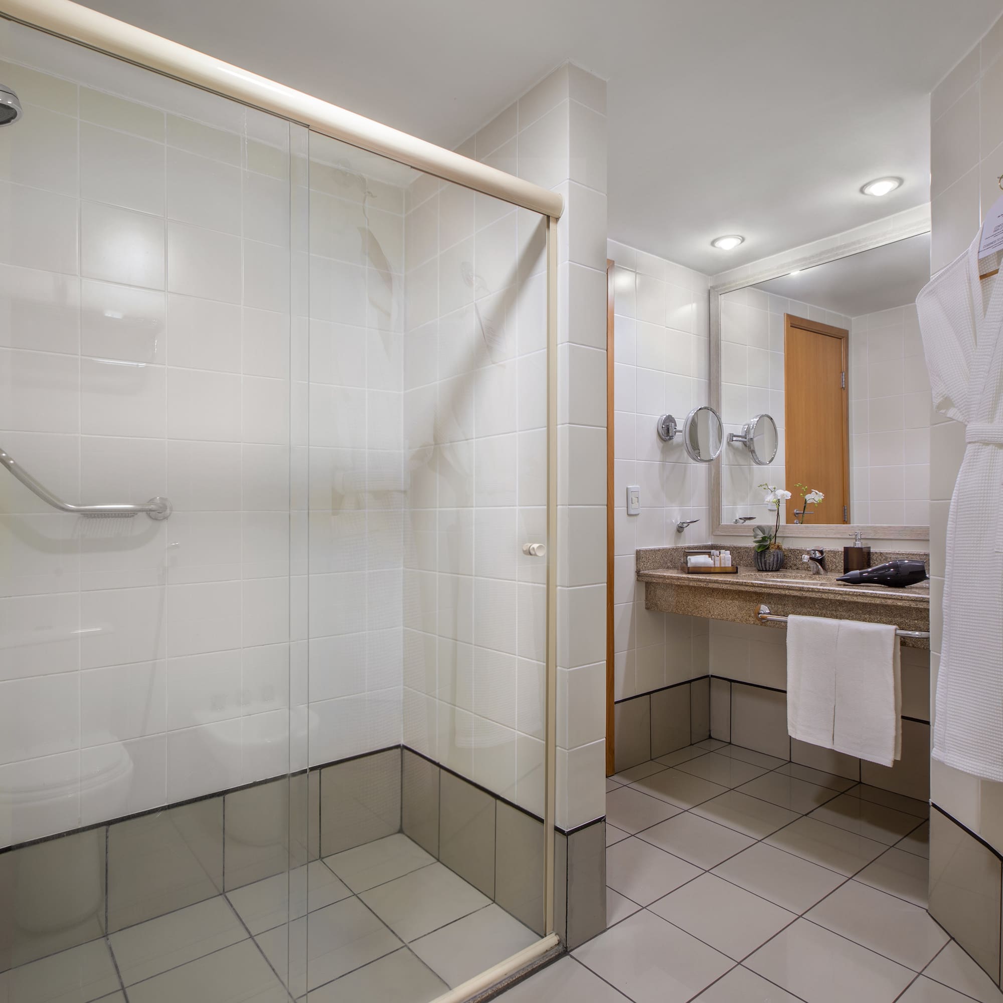 a bathroom with a glass shower door