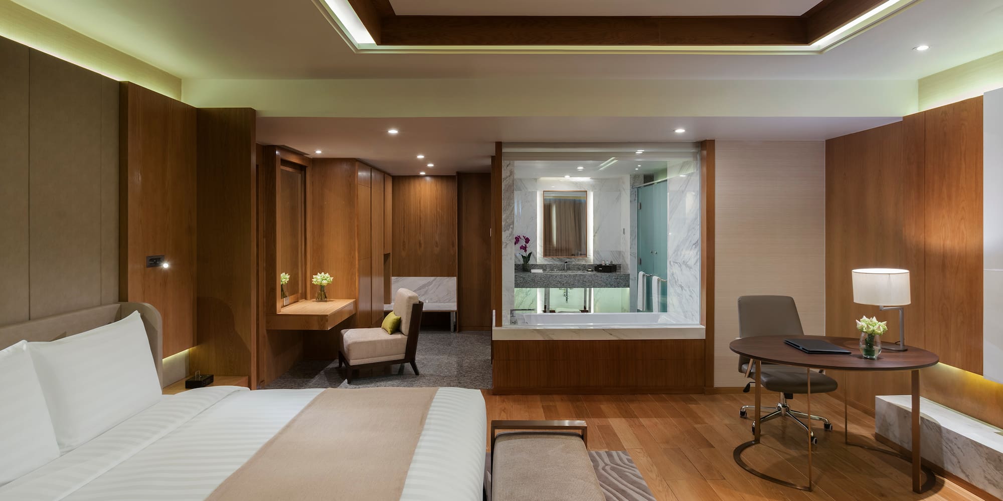 a room with a bed and a desk