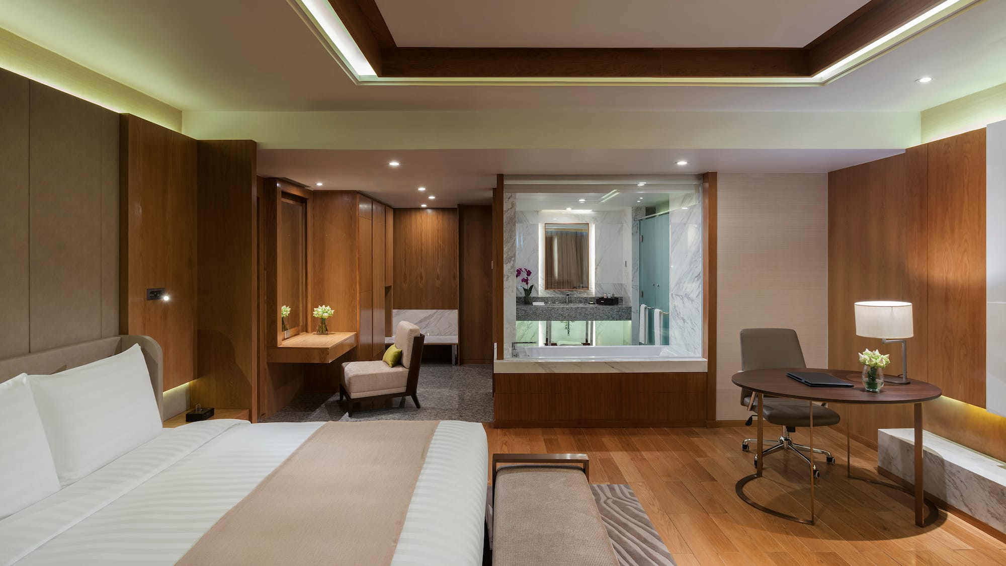 a room with a bed and a desk