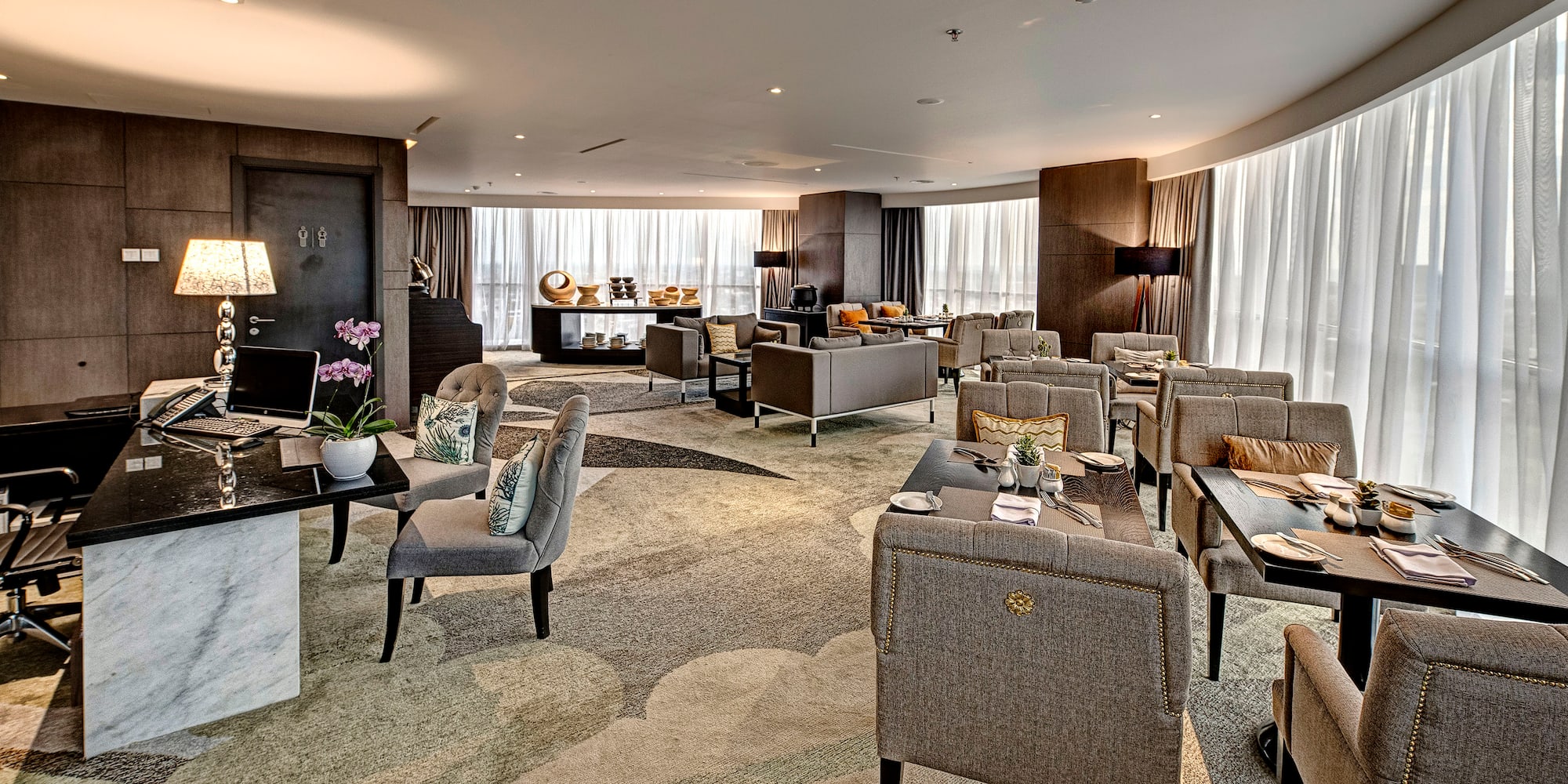 a room with a large table and chairs