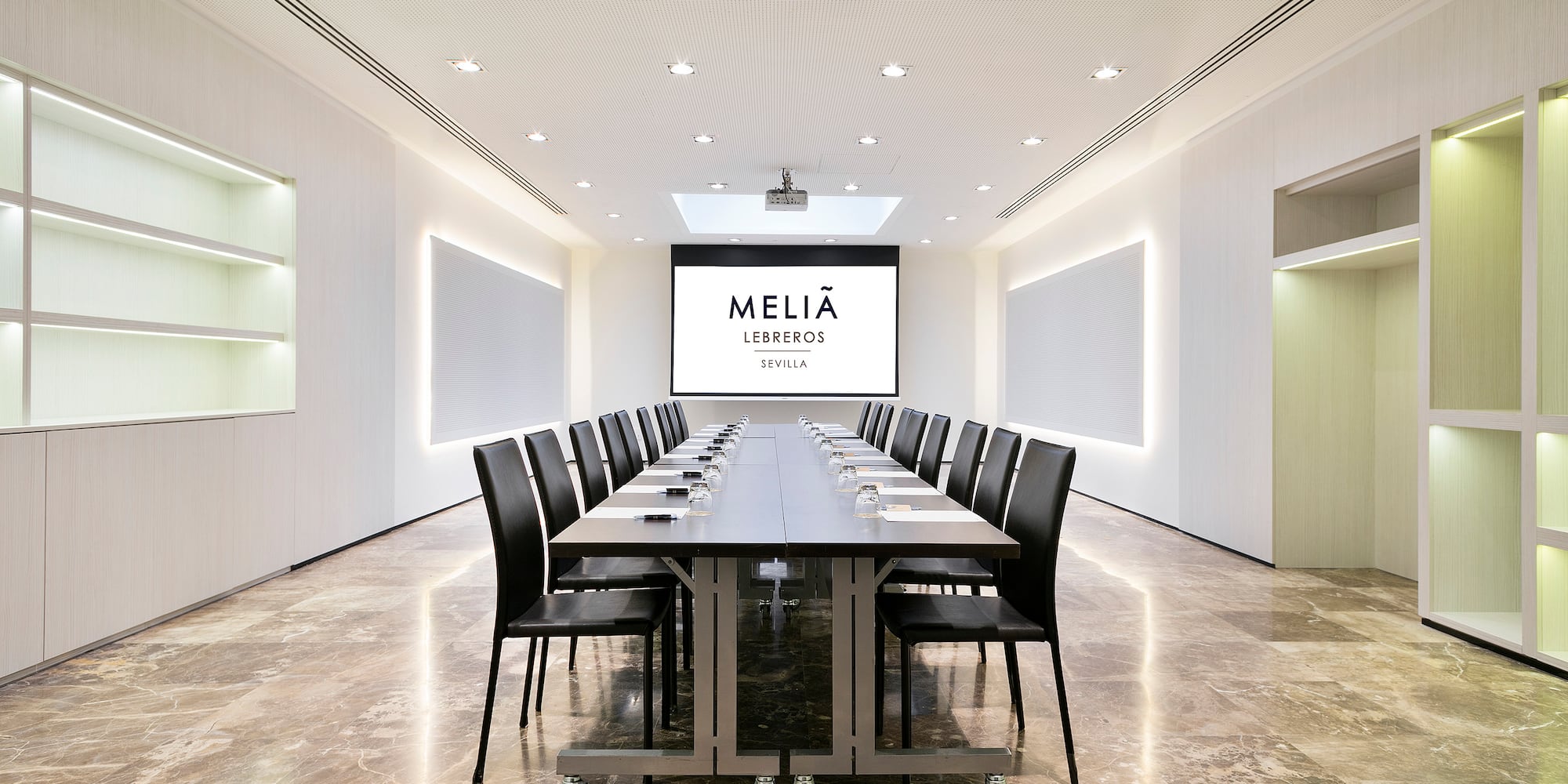 a conference room with a table and chairs