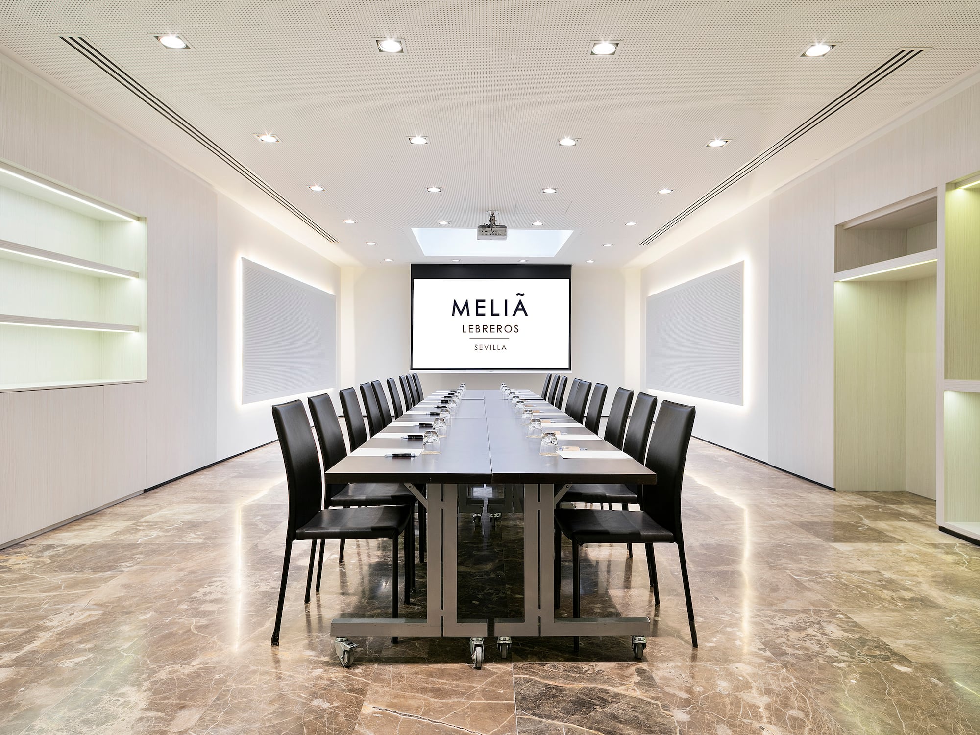 a conference room with a table and chairs