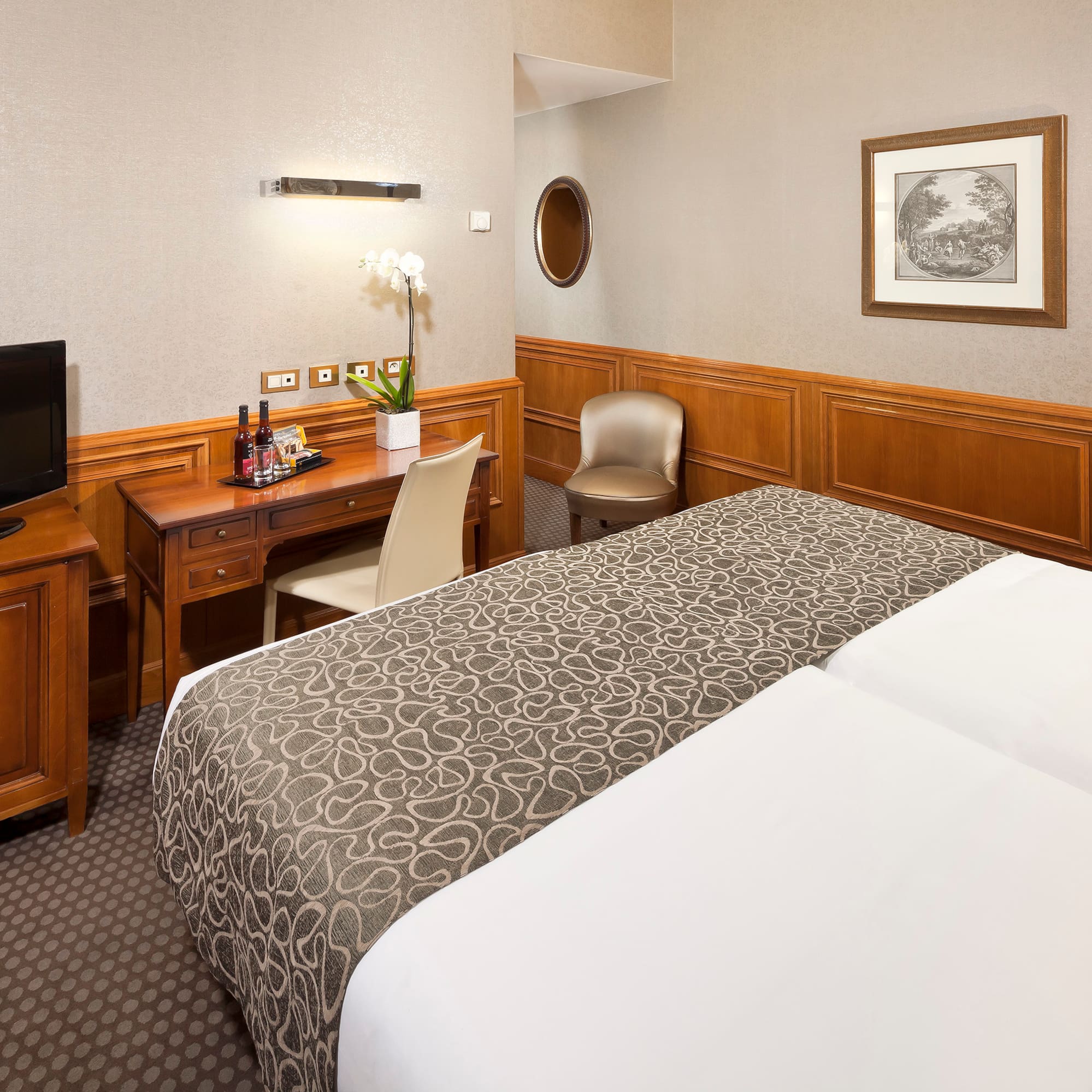 a room with a bed and a desk