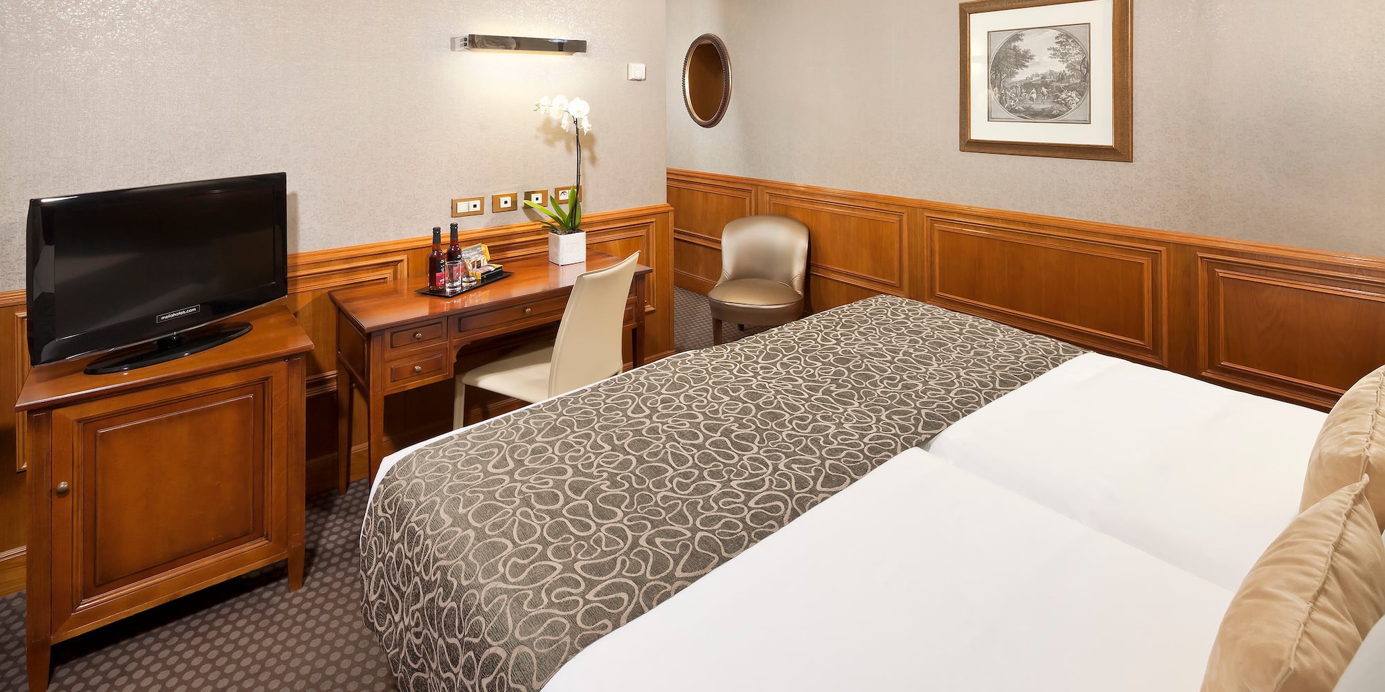 a room with a bed and a desk