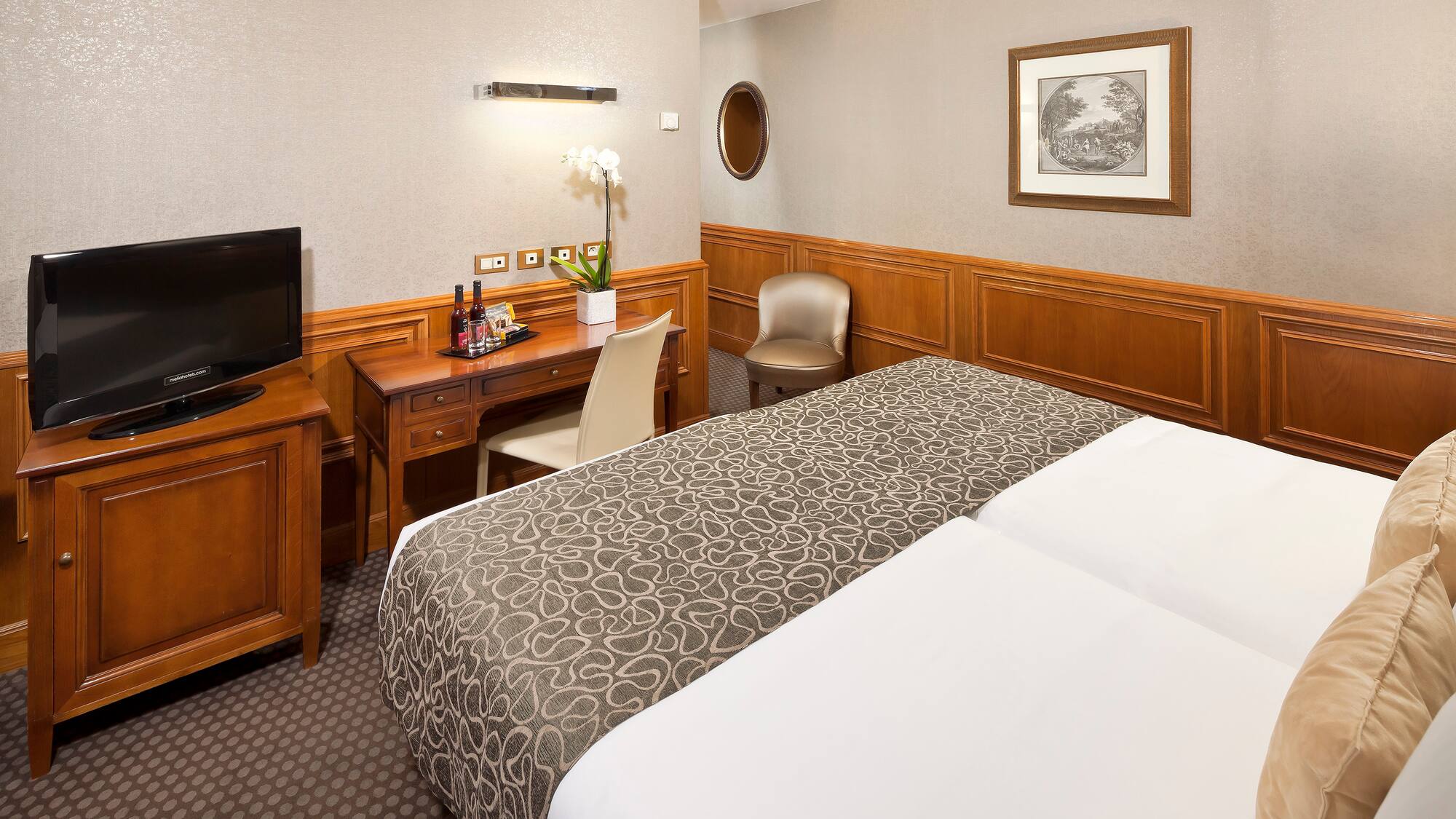 a room with a bed and a desk