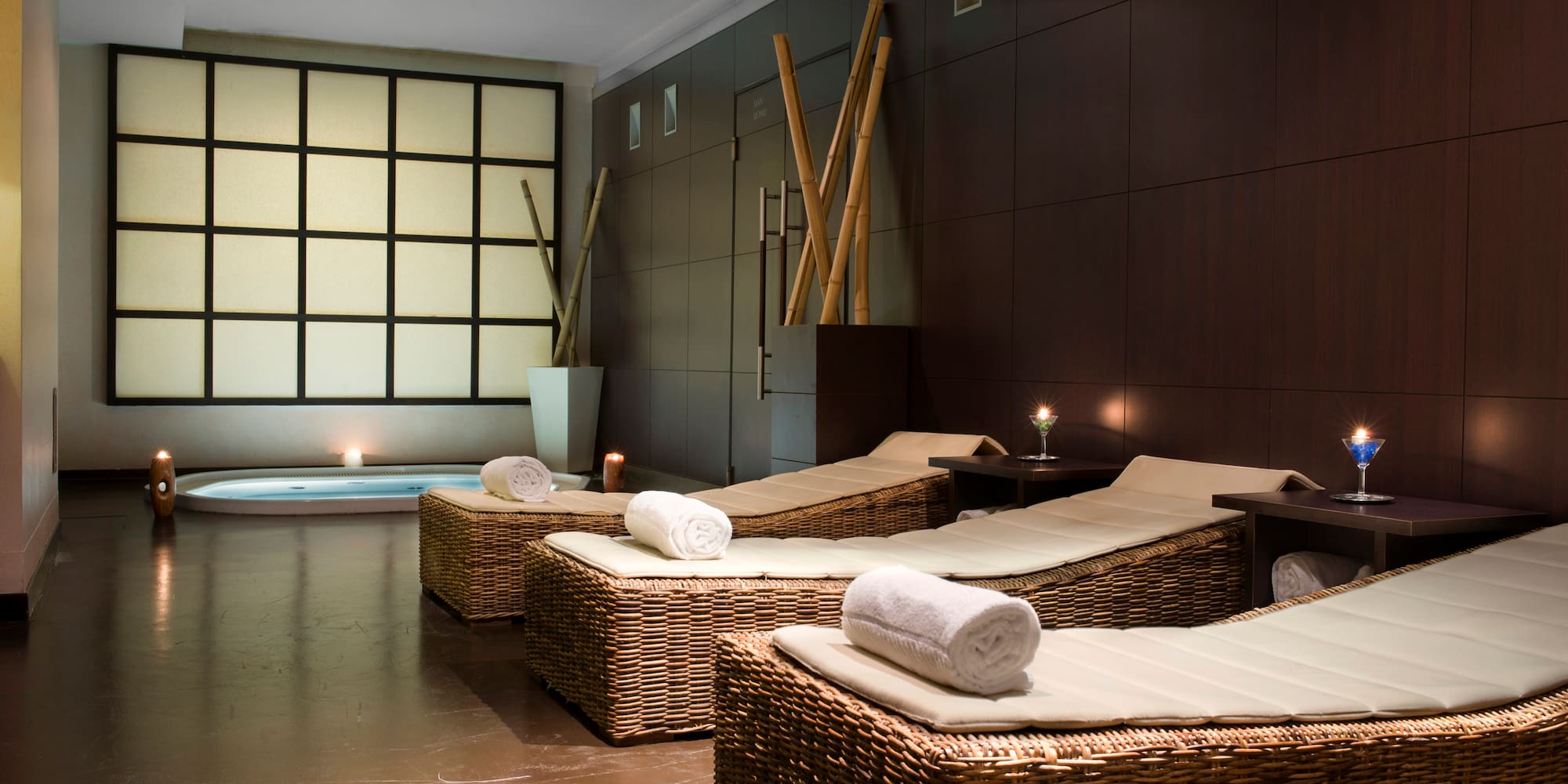 a room with chairs and a bathtub