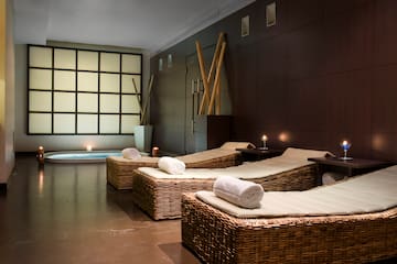 a room with chairs and a bathtub