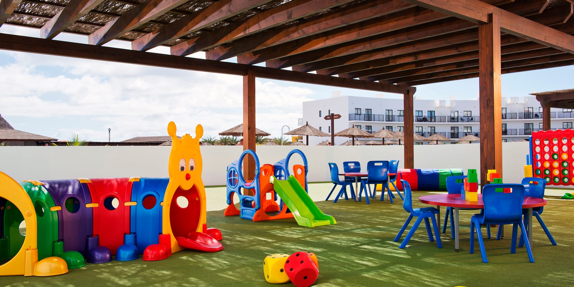 a playground with colorful toys and tables