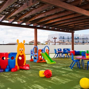 a playground with colorful toys and tables