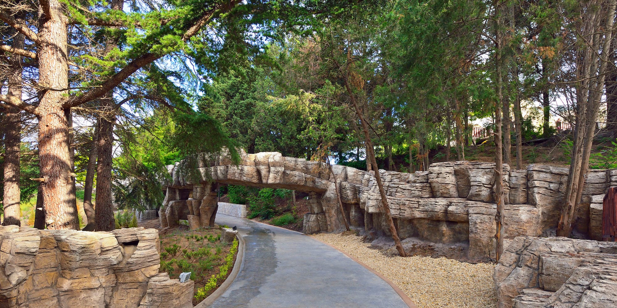 a stone bridge over a walkway