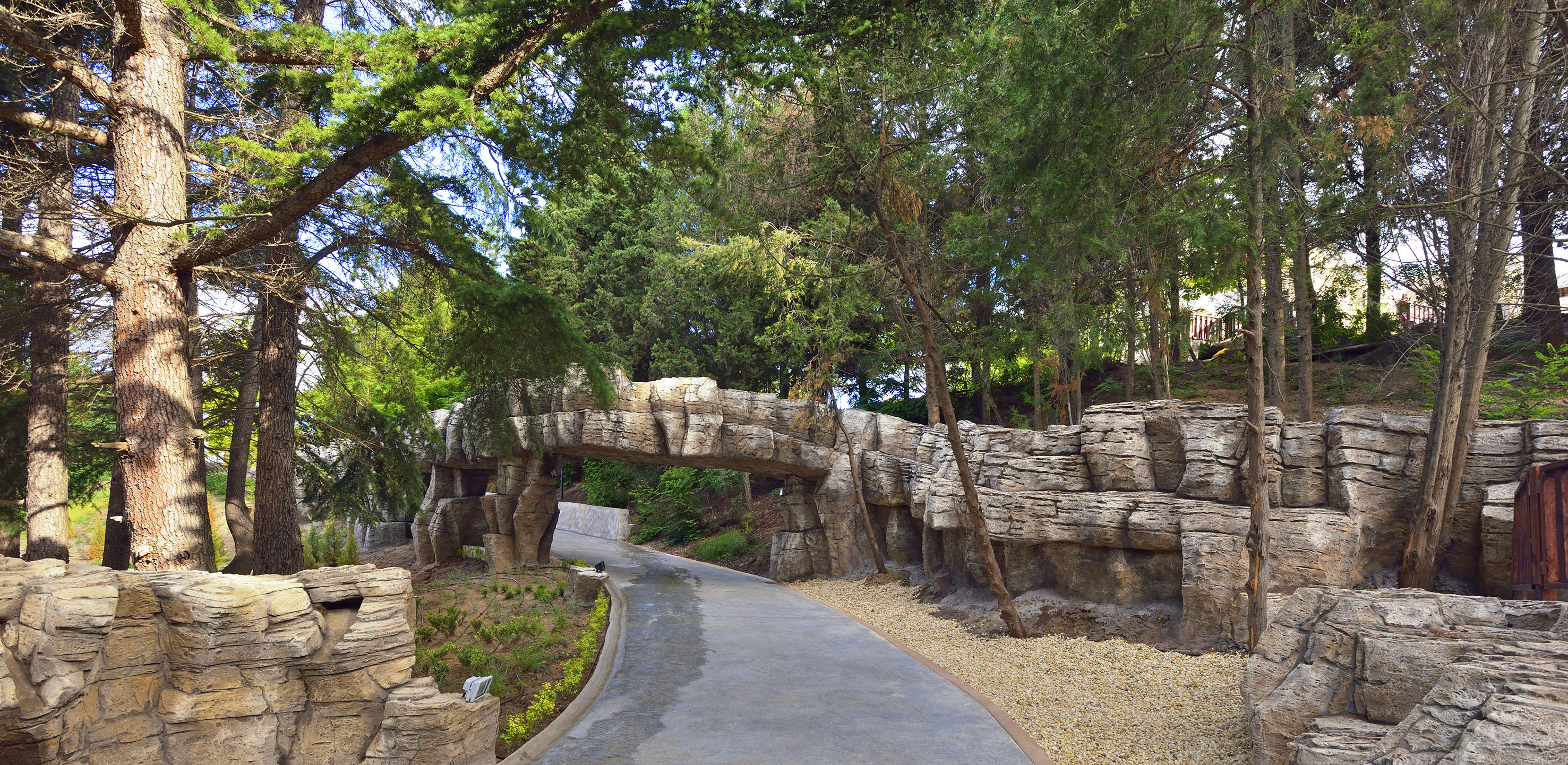 a stone bridge over a walkway