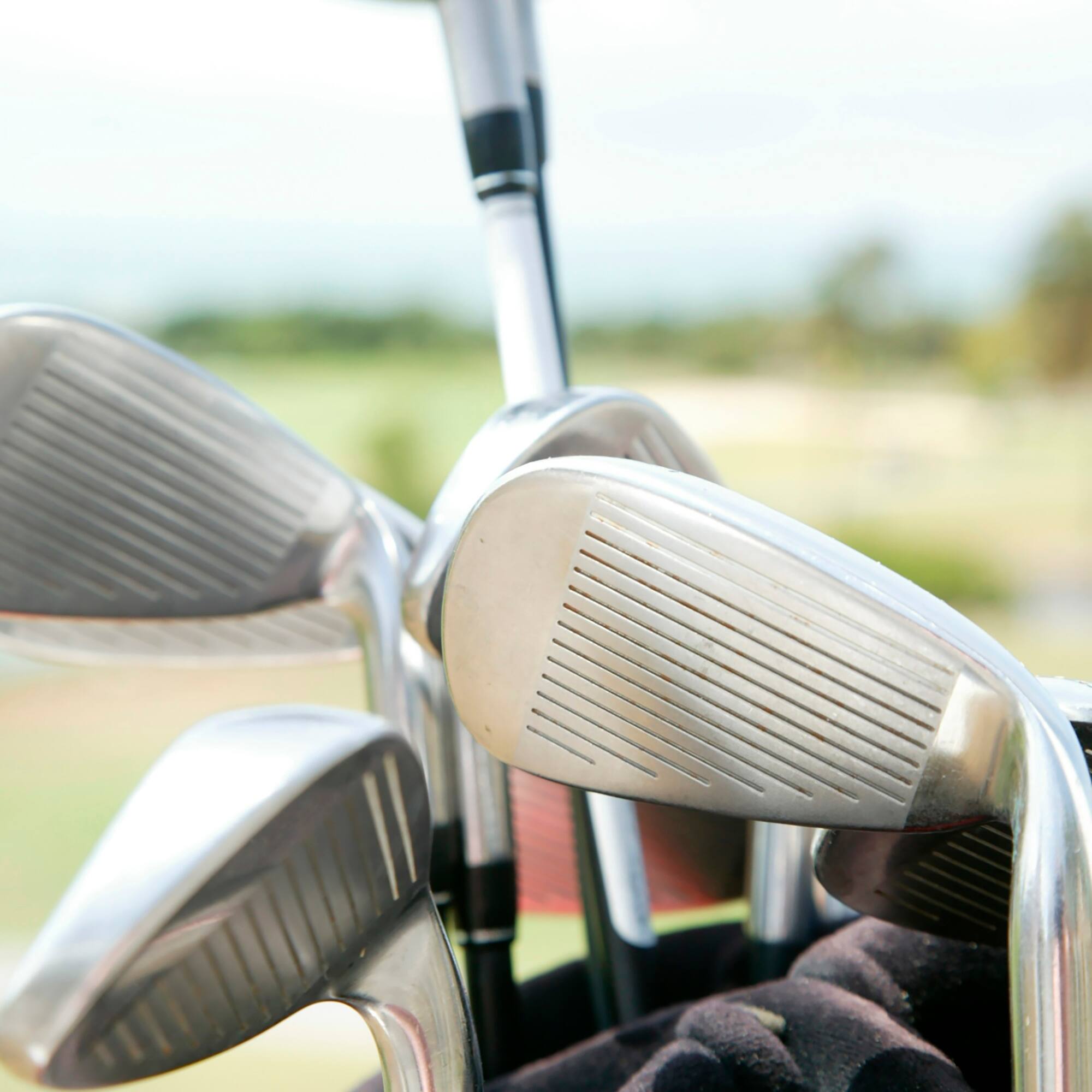 a group of golf clubs