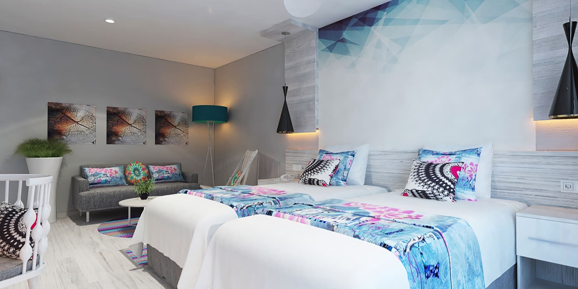 a room with two beds and a lamp