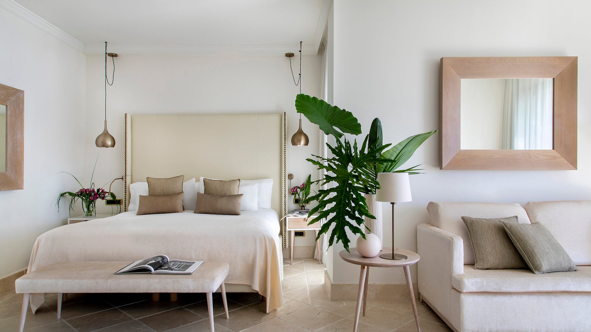 a bedroom with a bed and a couch