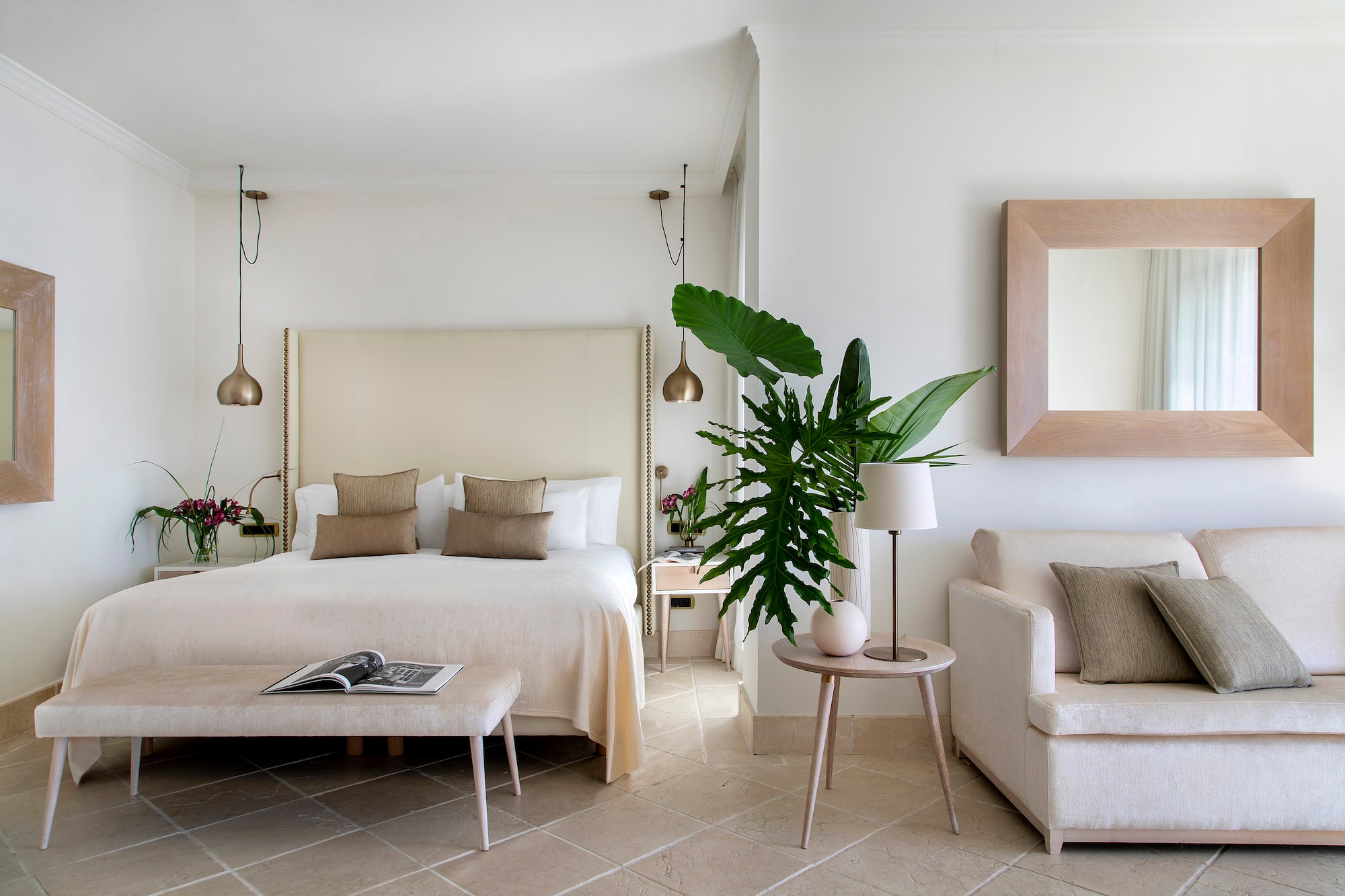 a bedroom with a bed and a couch