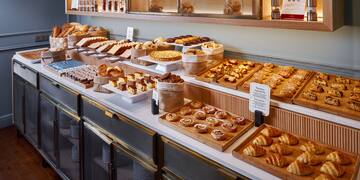 a counter with different types of pastries