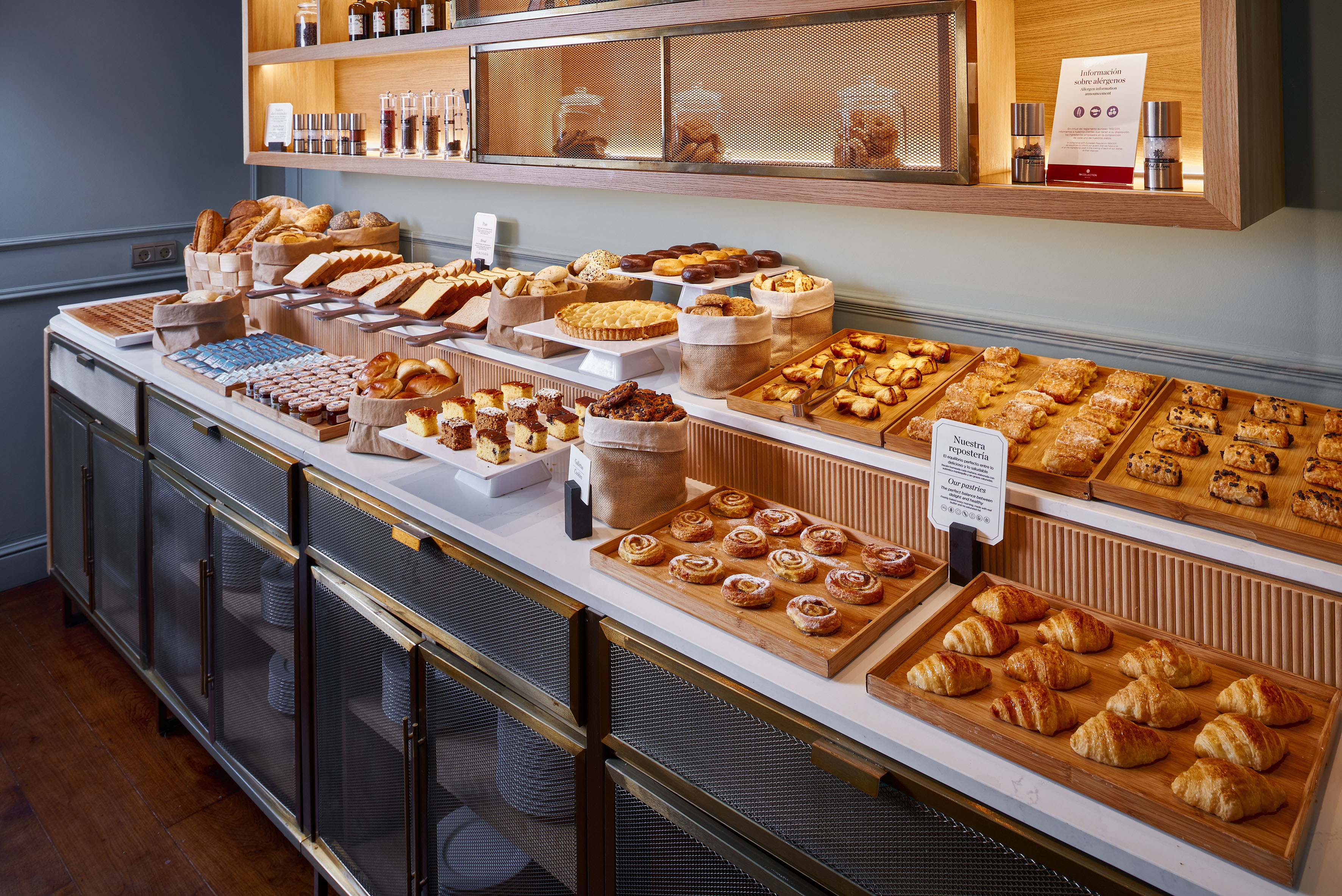 Extensive hotel breakfast buffet showcasing fresh pastries, breads, and desserts. - Buffet Espolita, Cuisine internationale - Palacio de Avilés Affiliated by Meliá, Avilés