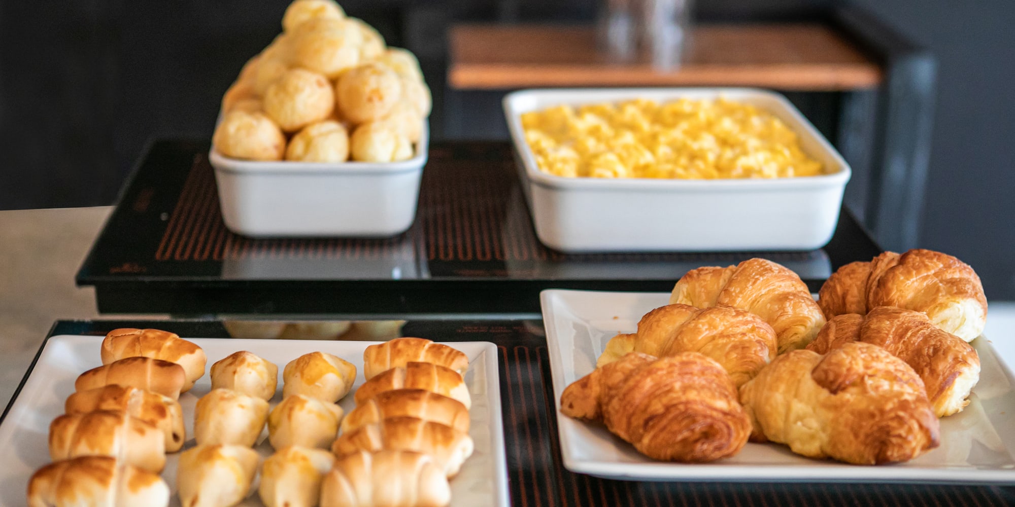 a group of white plates of food on a table