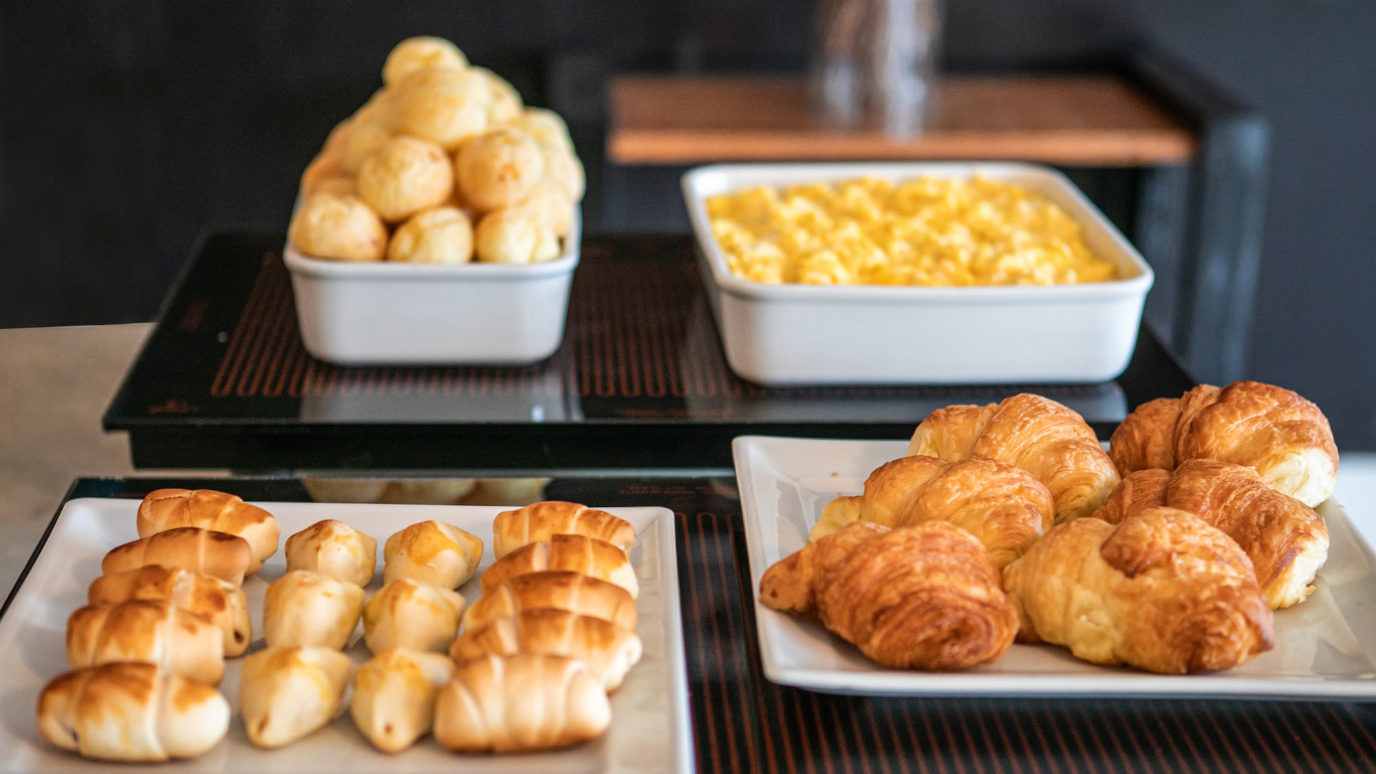 a group of white plates of food on a table