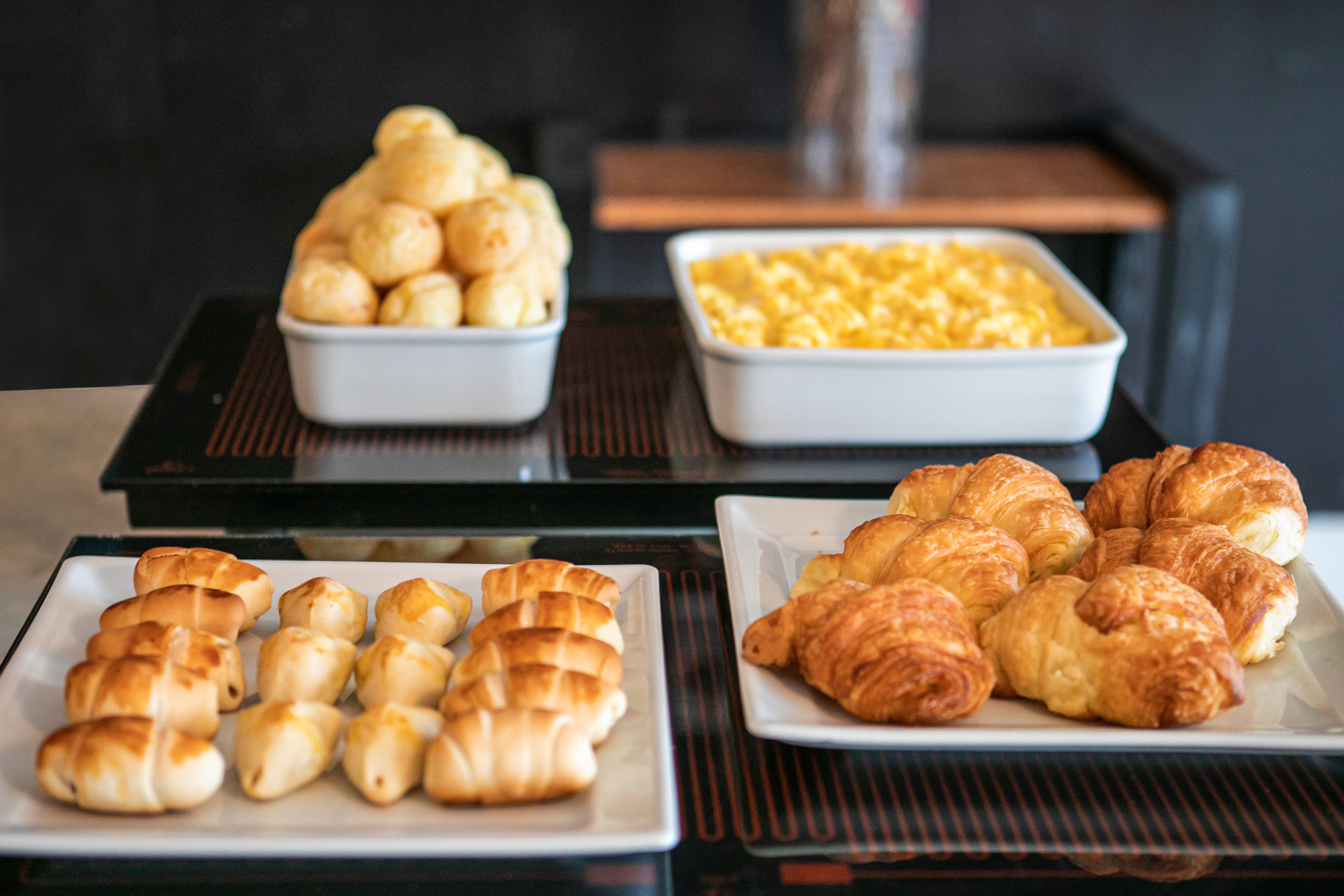 a group of white plates of food on a table
