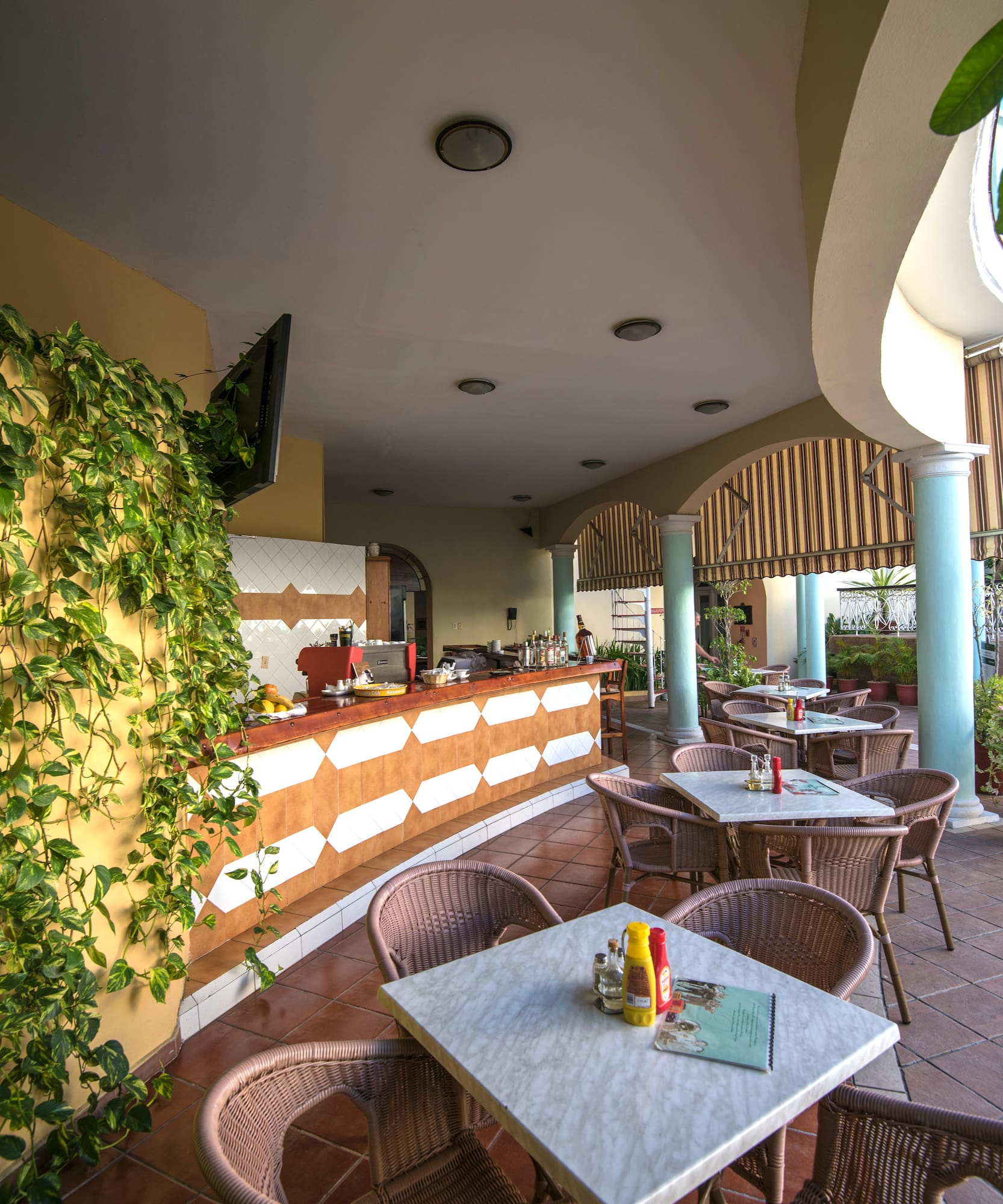 a patio with tables and chairs
