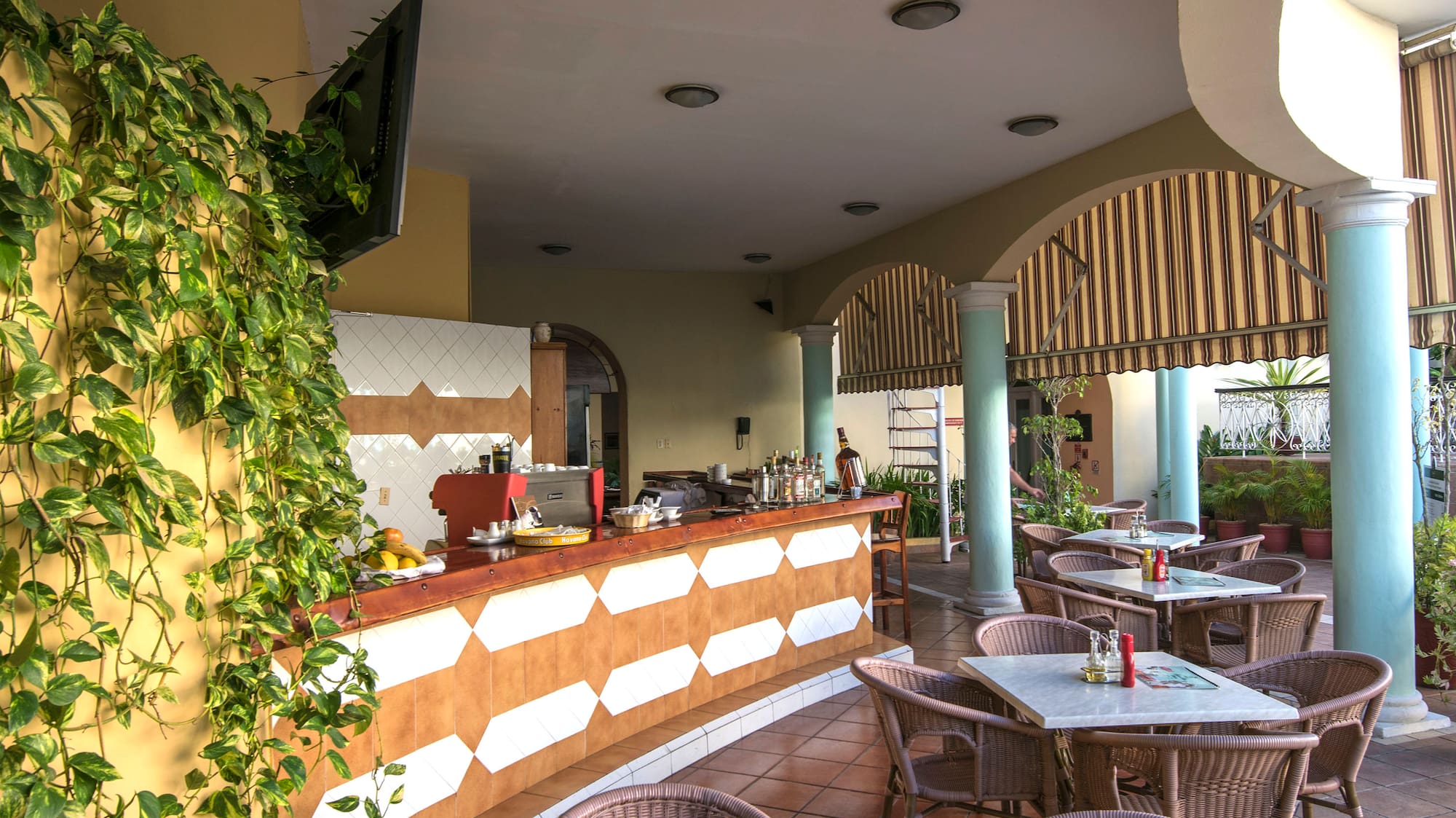 a patio with tables and chairs